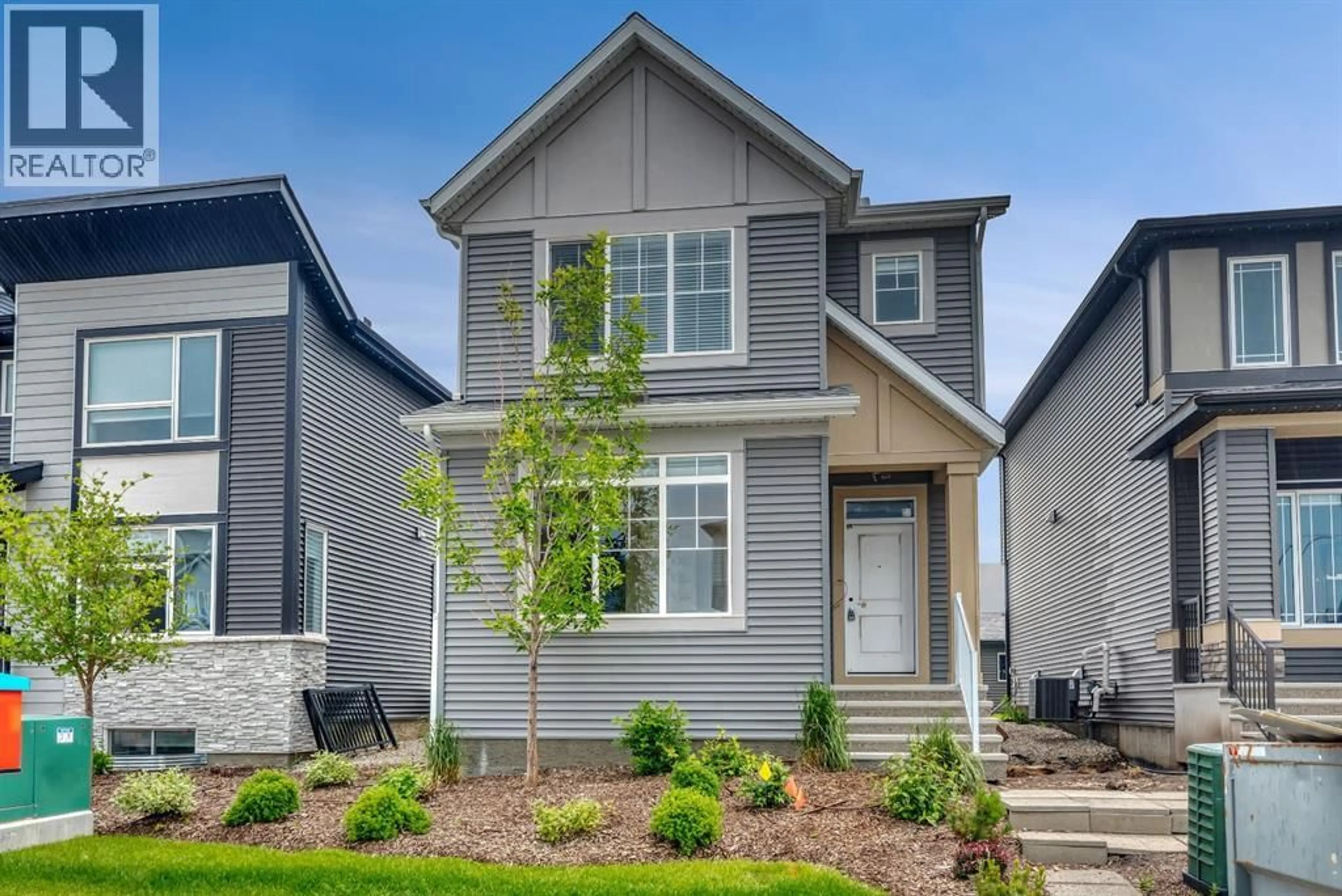 Home with vinyl exterior material, street for 12 BELMONT PLACE SOUTHWEST, Calgary Alberta T2X5T6