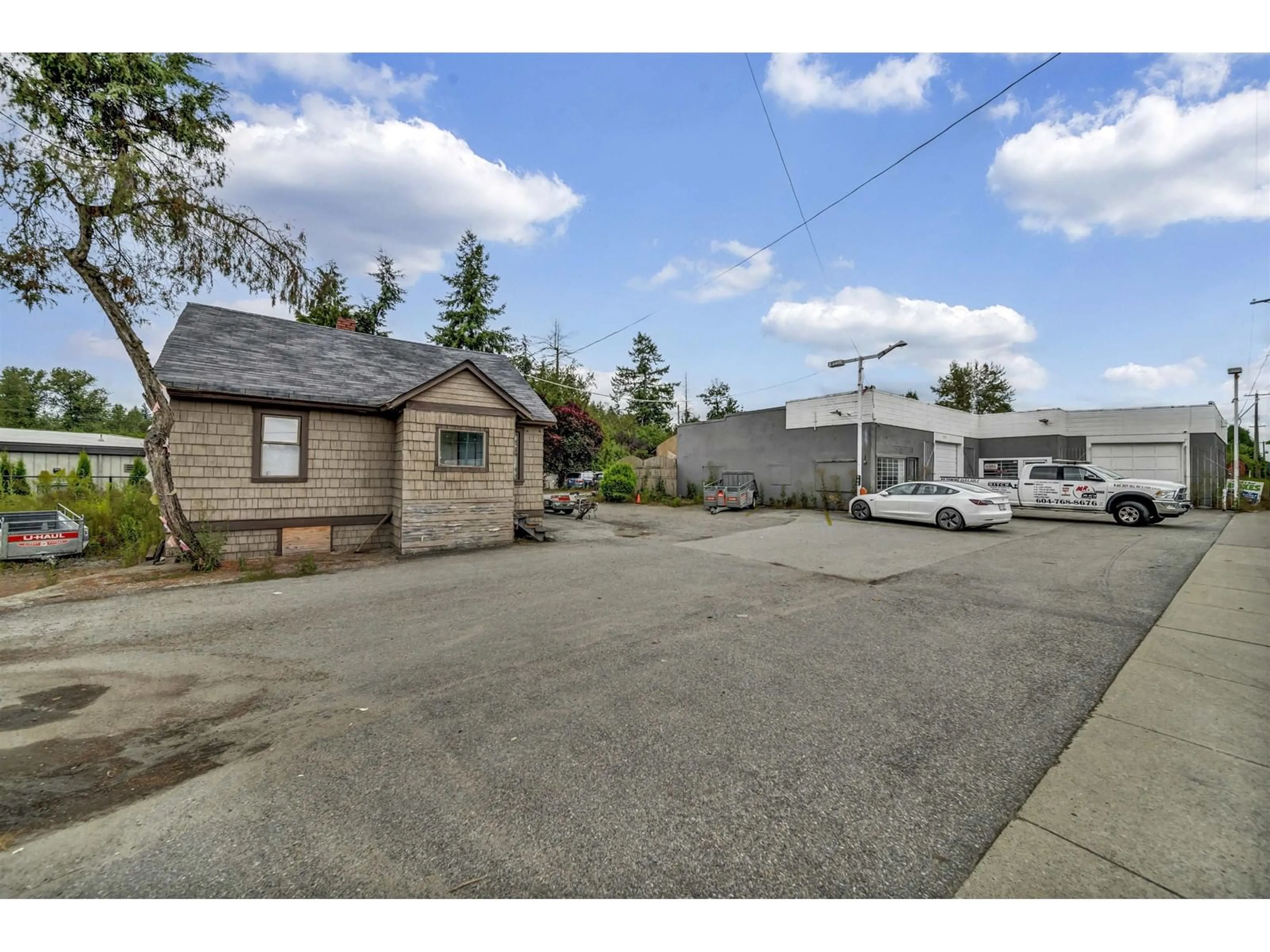 A pic from outside/outdoor area/front of a property/back of a property/a pic from drone, street for 23359 FRASER, Langley British Columbia V2Z2K6