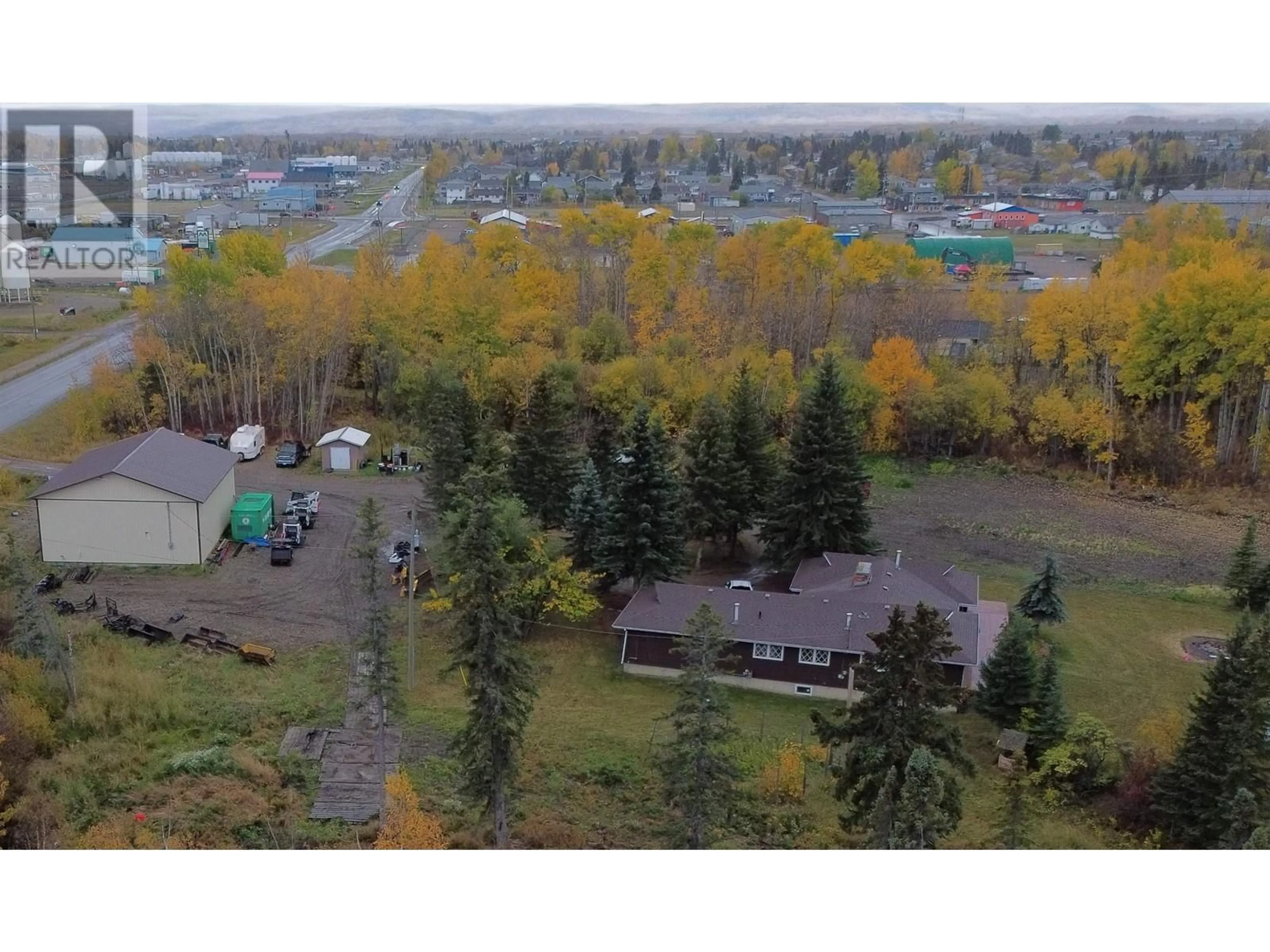 A pic from outside/outdoor area/front of a property/back of a property/a pic from drone, mountain view for 10412 NORTHERN LIGHTS DRIVE, Fort St. John British Columbia V1J0S8