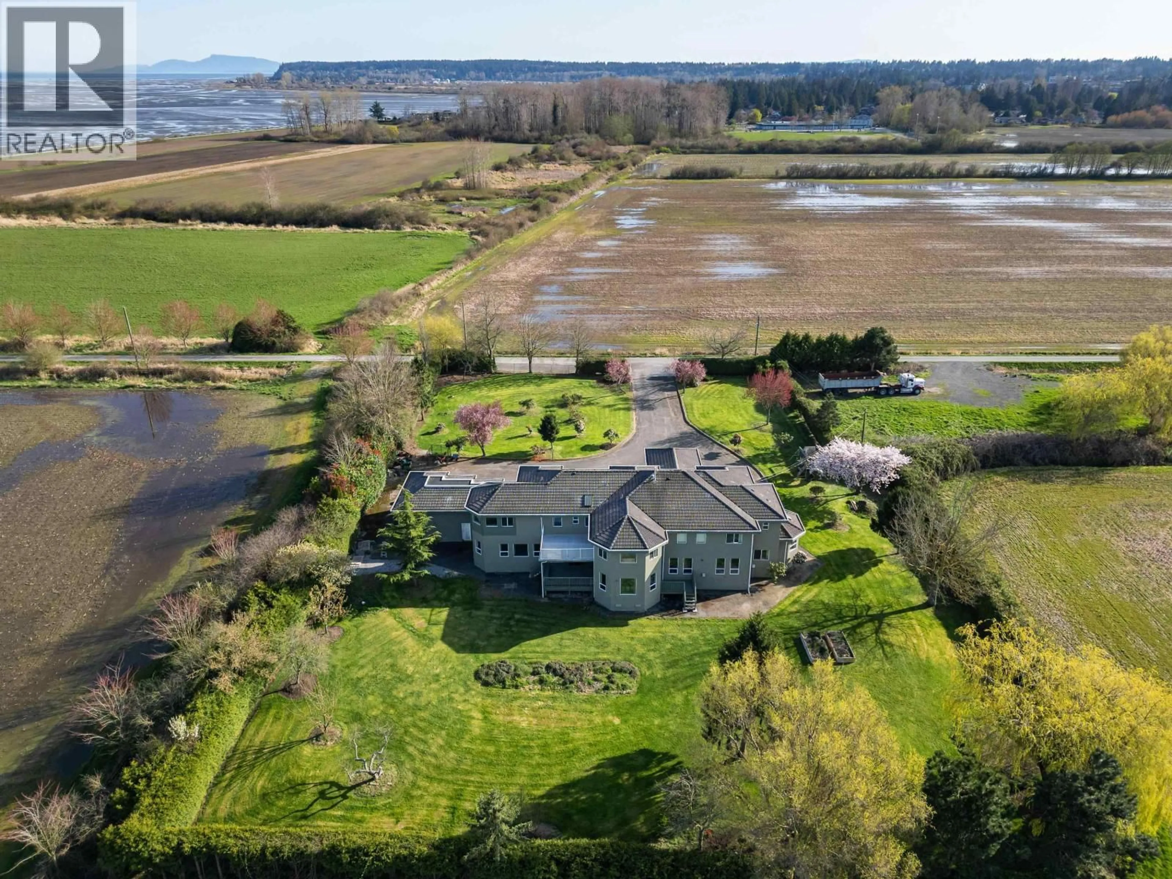 A pic from outside/outdoor area/front of a property/back of a property/a pic from drone, water/lake/river/ocean view for 2150 56 STREET, Delta British Columbia V4L2B1