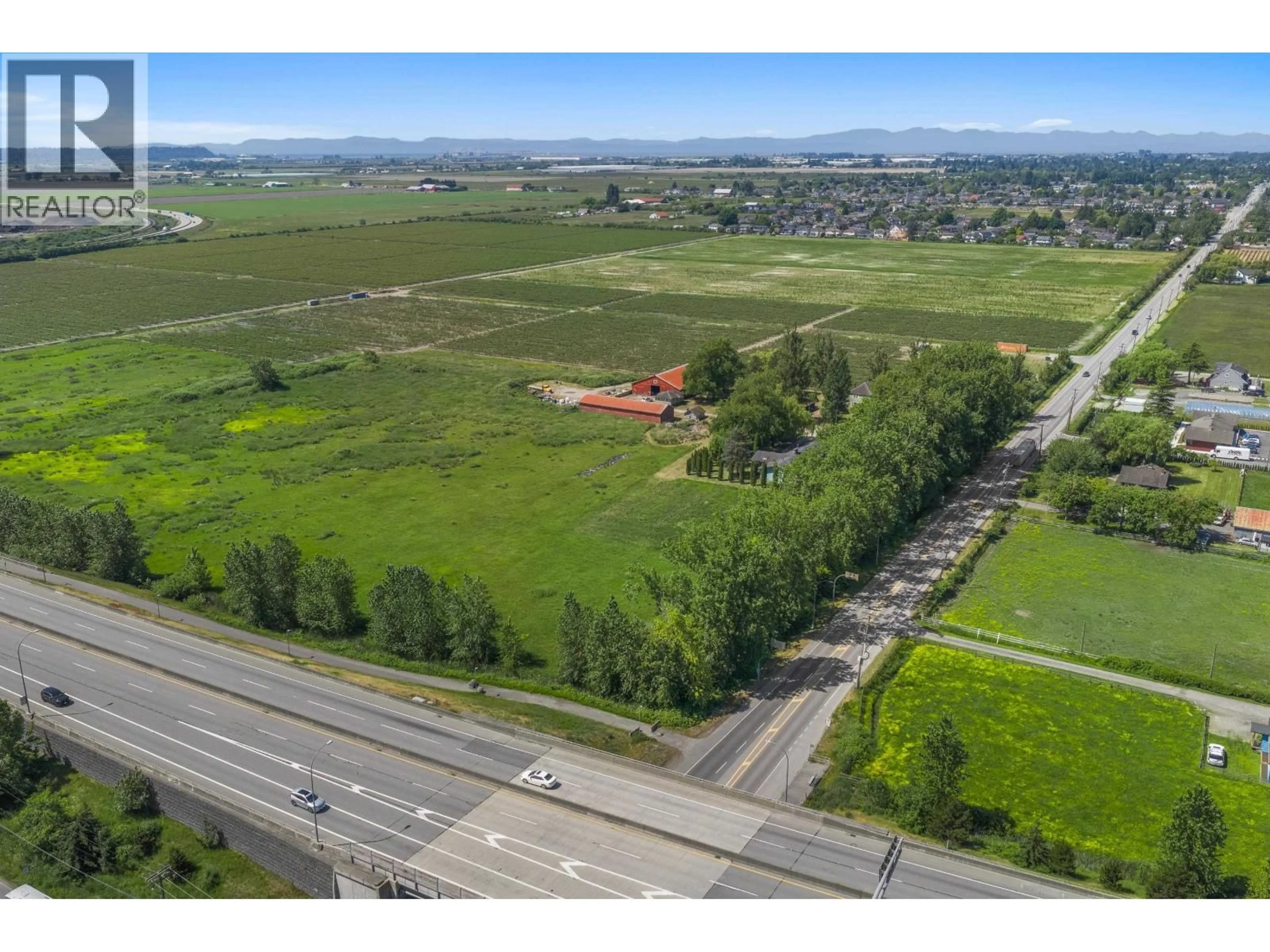 A pic from outside/outdoor area/front of a property/back of a property/a pic from drone, unknown for 7064 LADNER TRUNK ROAD, Delta British Columbia V4K3N3