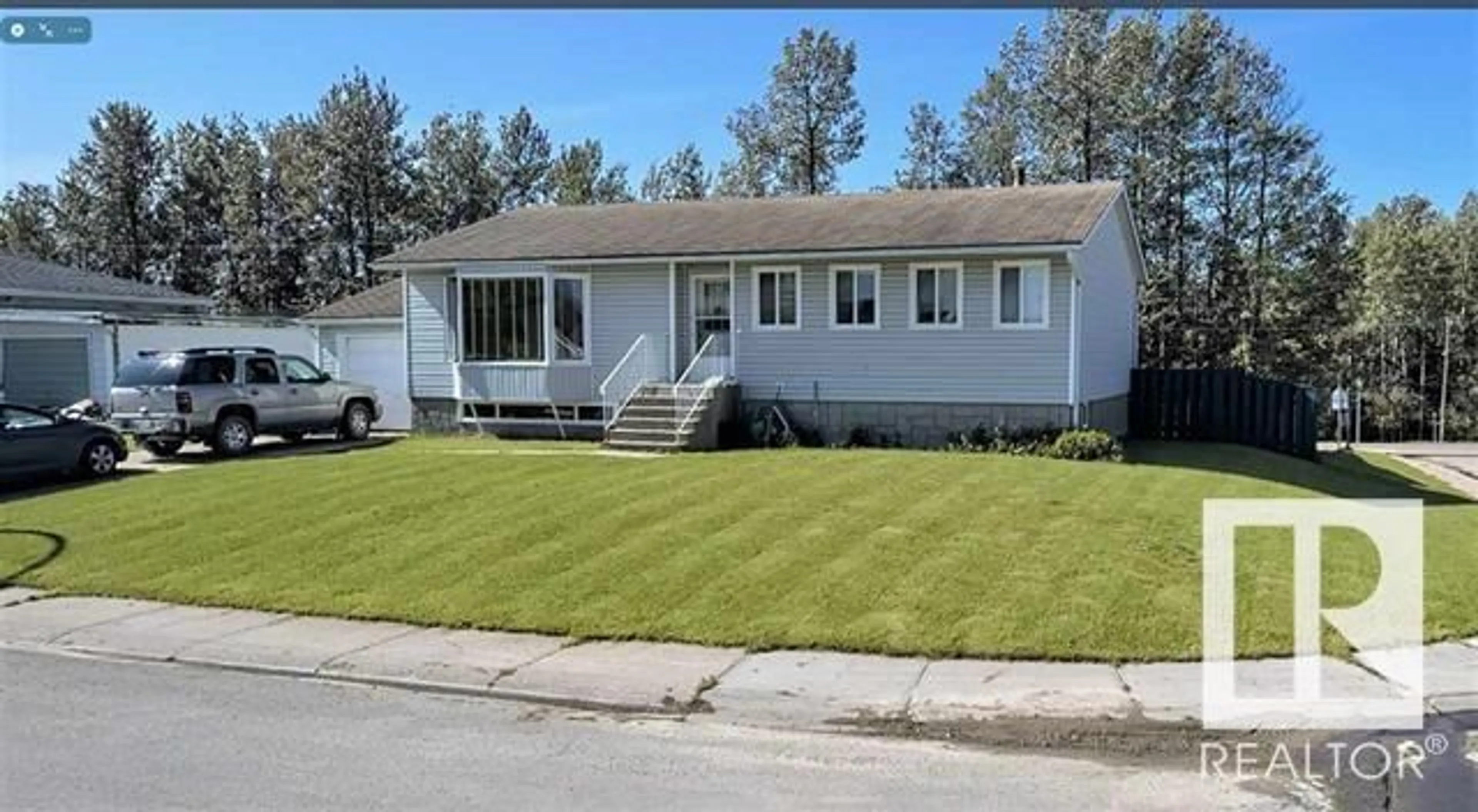 Home with vinyl exterior material, street for 715 3 AV, Fox Creek Alberta T0H1P0