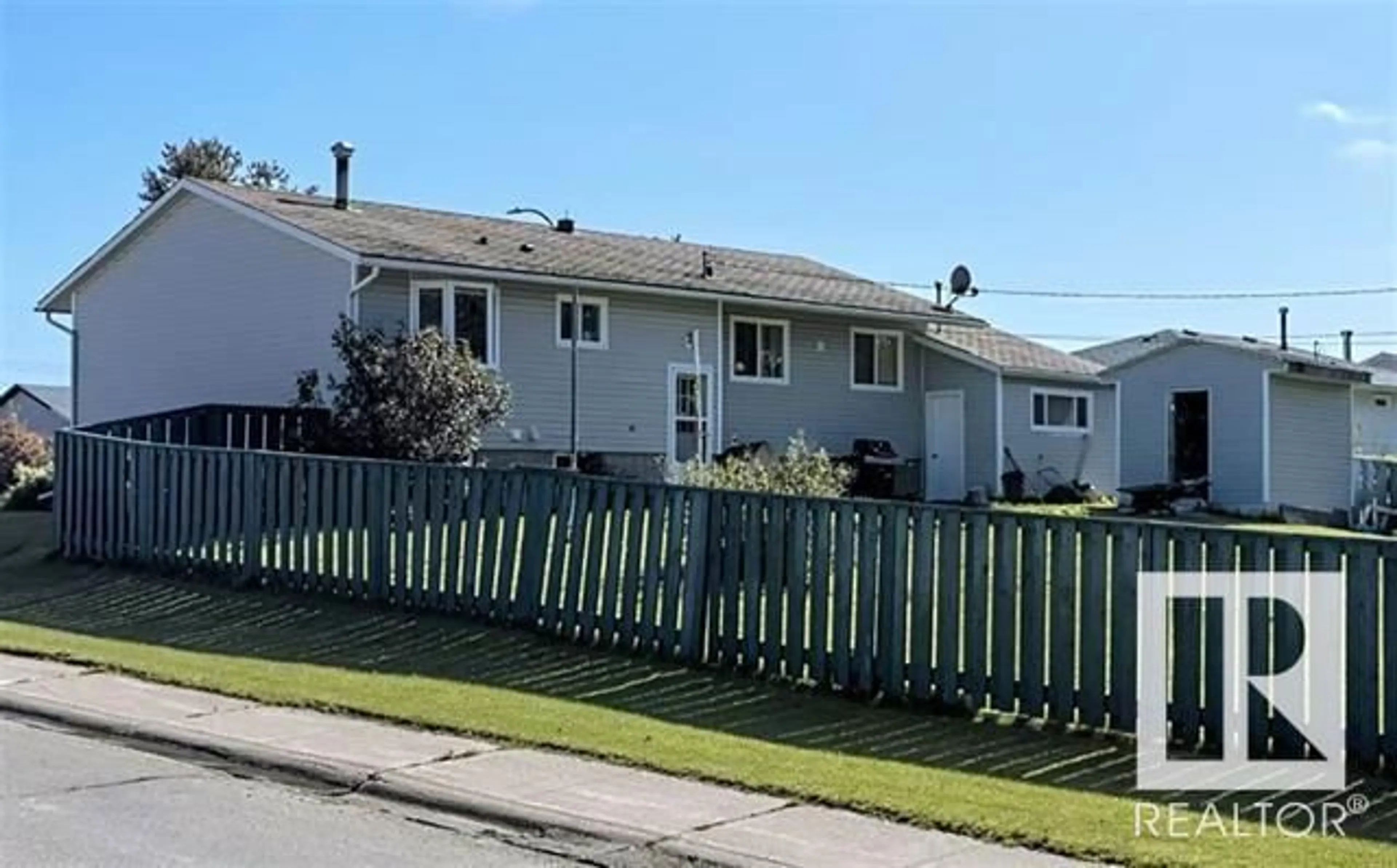 Home with vinyl exterior material, street for 715 3 AV, Fox Creek Alberta T0H1P0