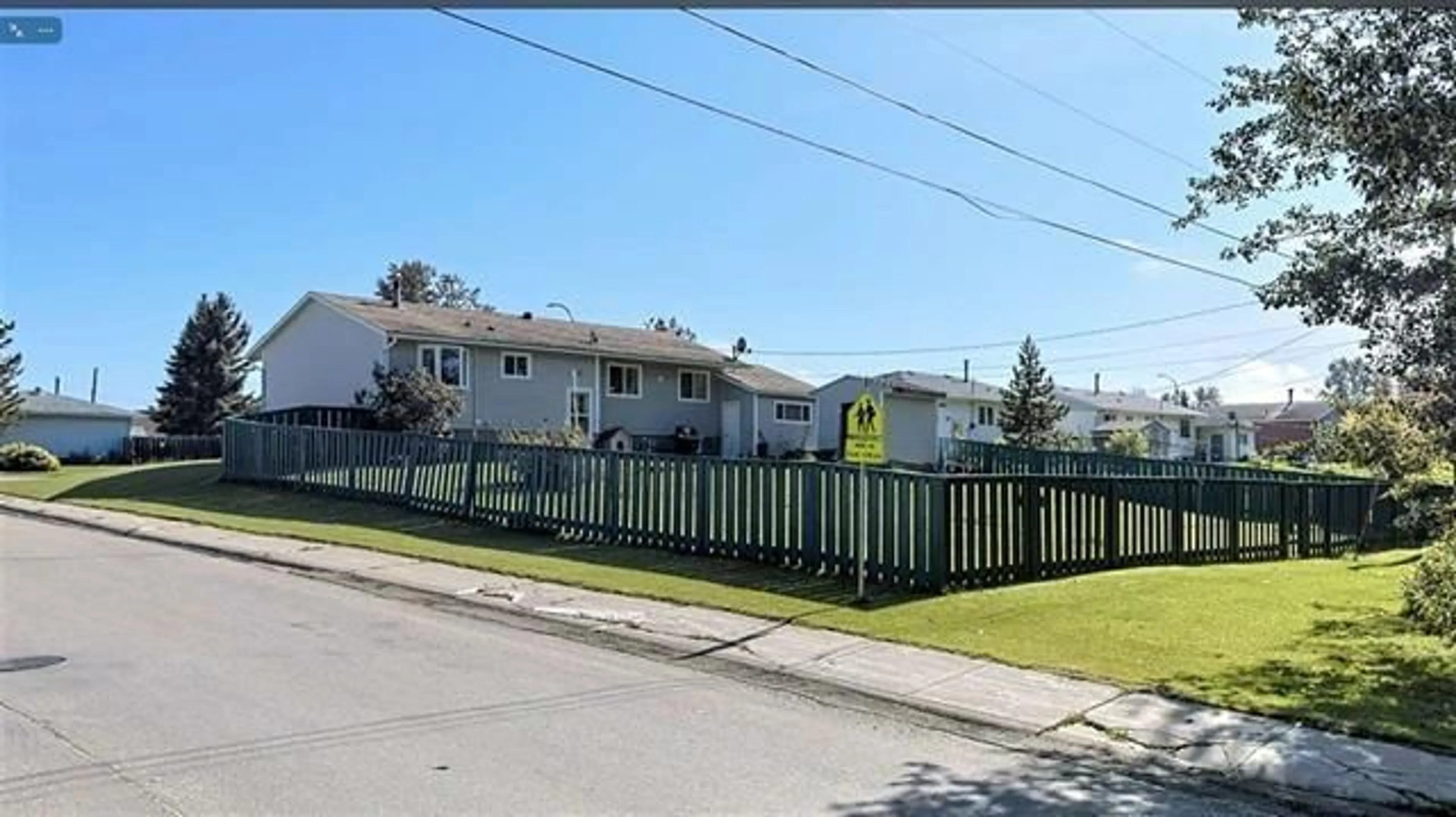 Frontside or backside of a home, the fenced backyard for 715 3 AV, Fox Creek Alberta T0H1P0