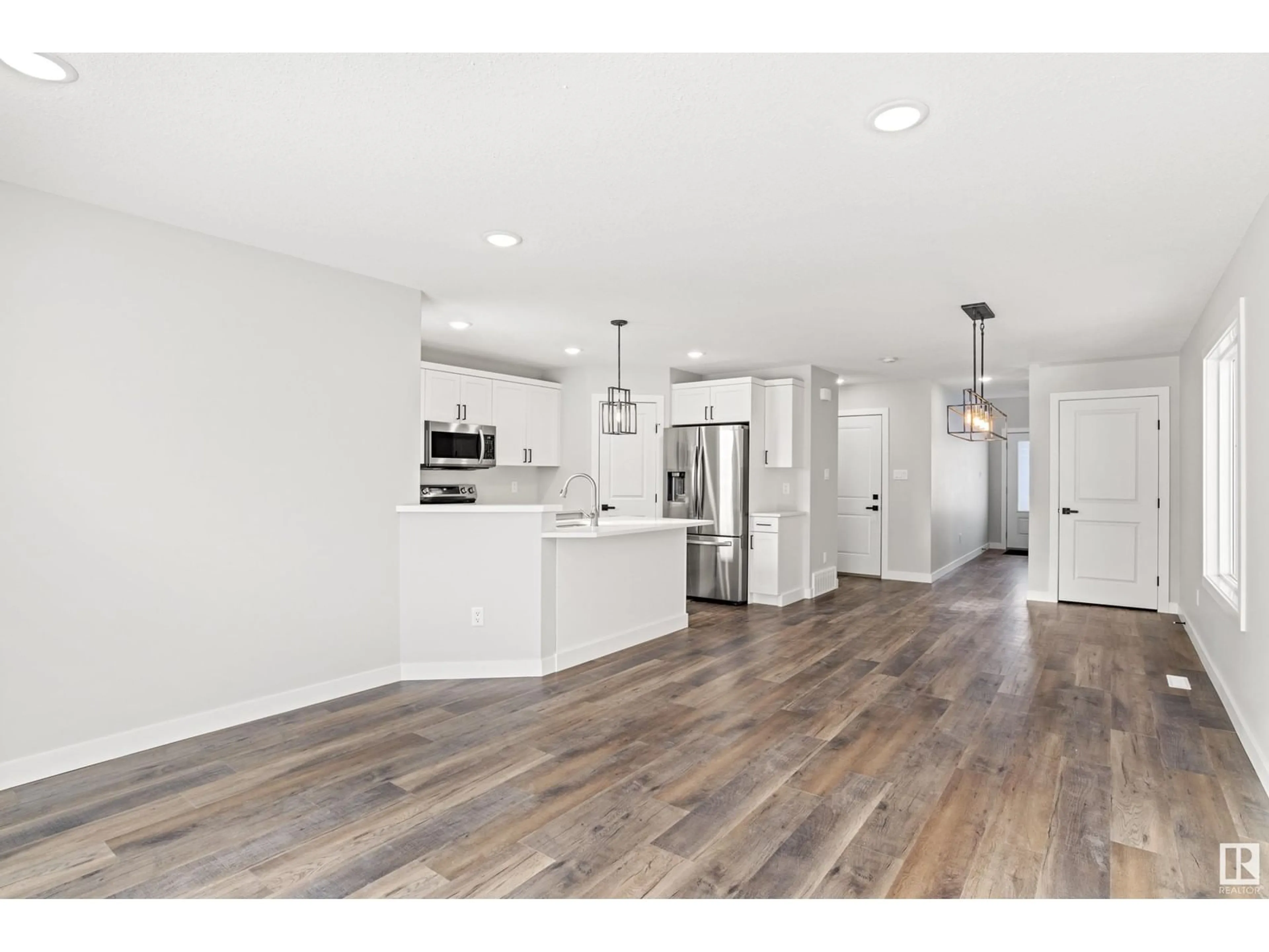 Open concept kitchen, wood/laminate floor for 1709A CRESTVIEW WY, Cold Lake Alberta T9M0L8