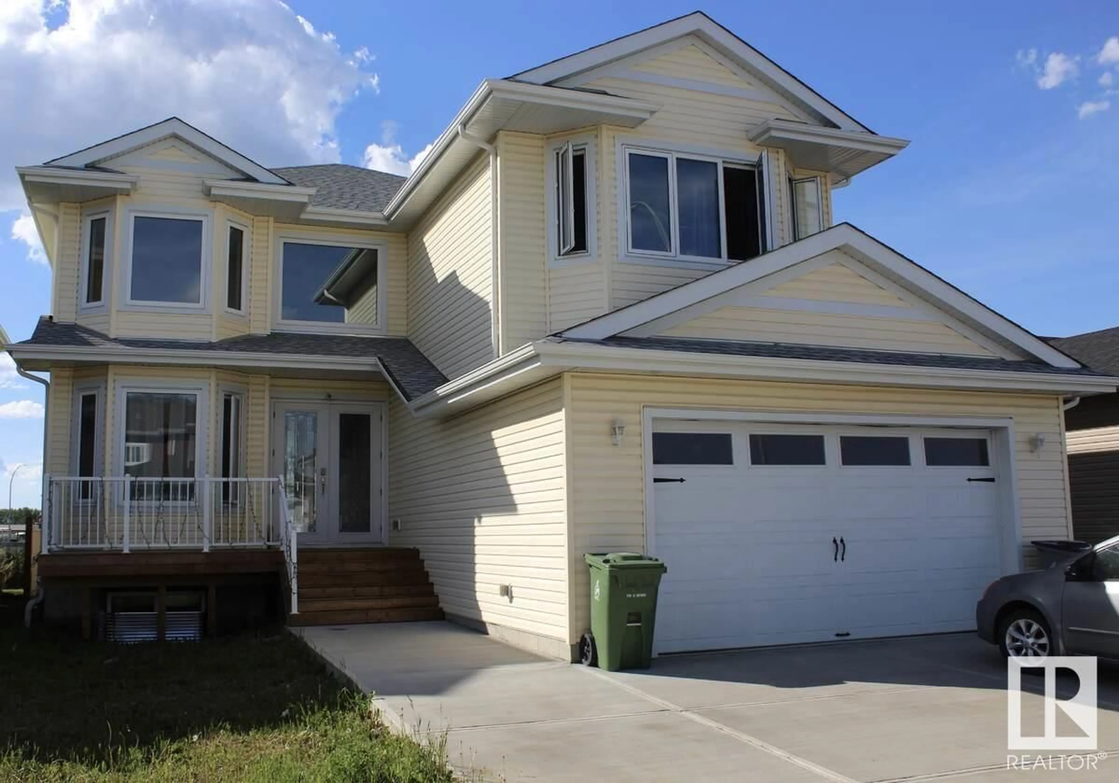 Frontside or backside of a home, the street view for 128 Houle DR, Morinville Alberta T8R0E1