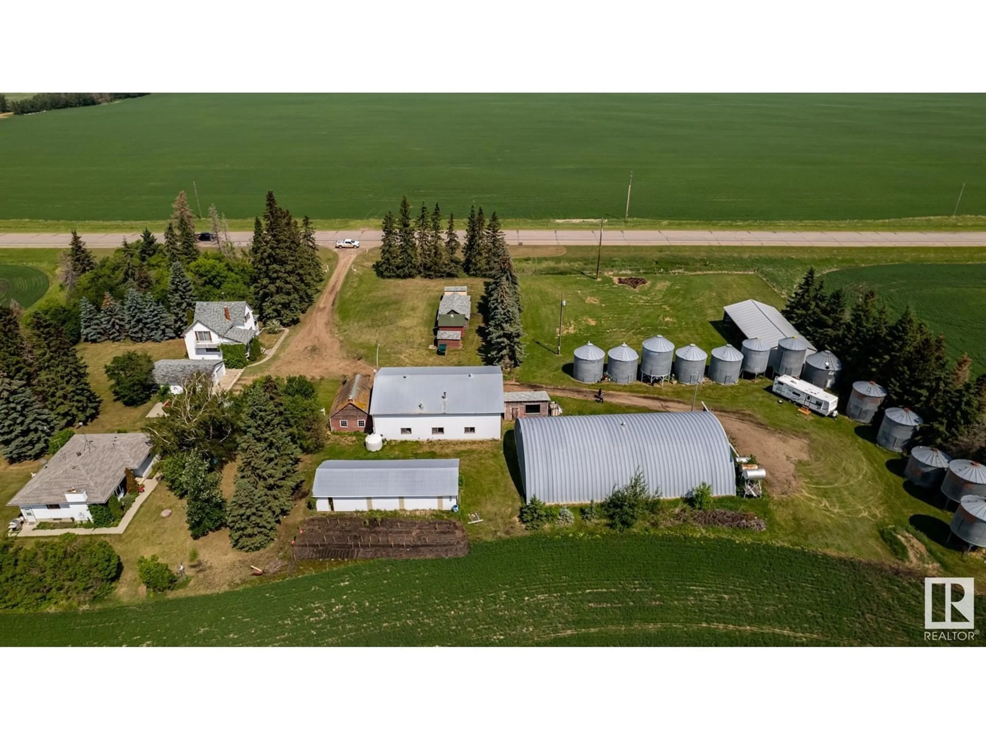 A pic from outside/outdoor area/front of a property/back of a property/a pic from drone, building for 20469 HWY 15, Rural Strathcona County Alberta T8L4B1