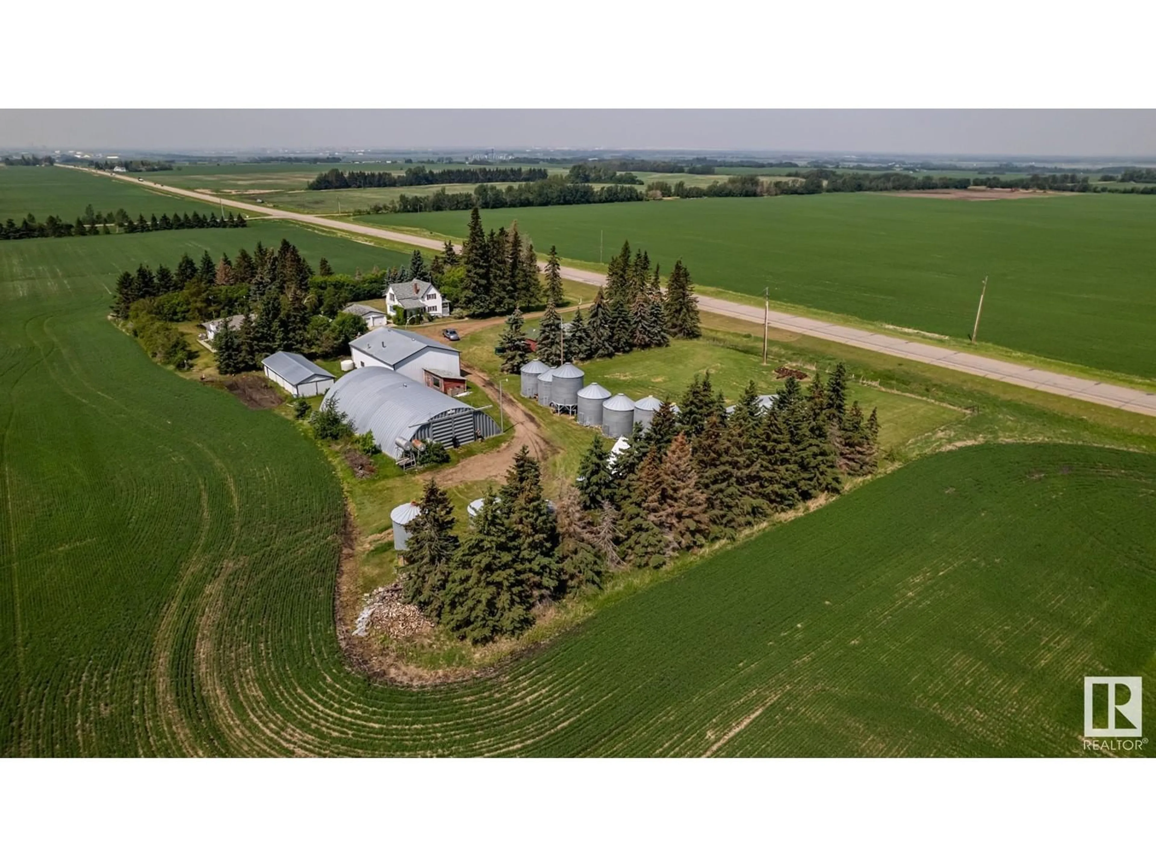 A pic from outside/outdoor area/front of a property/back of a property/a pic from drone, mountain view for 20469 HWY 15, Rural Strathcona County Alberta T8L4B1