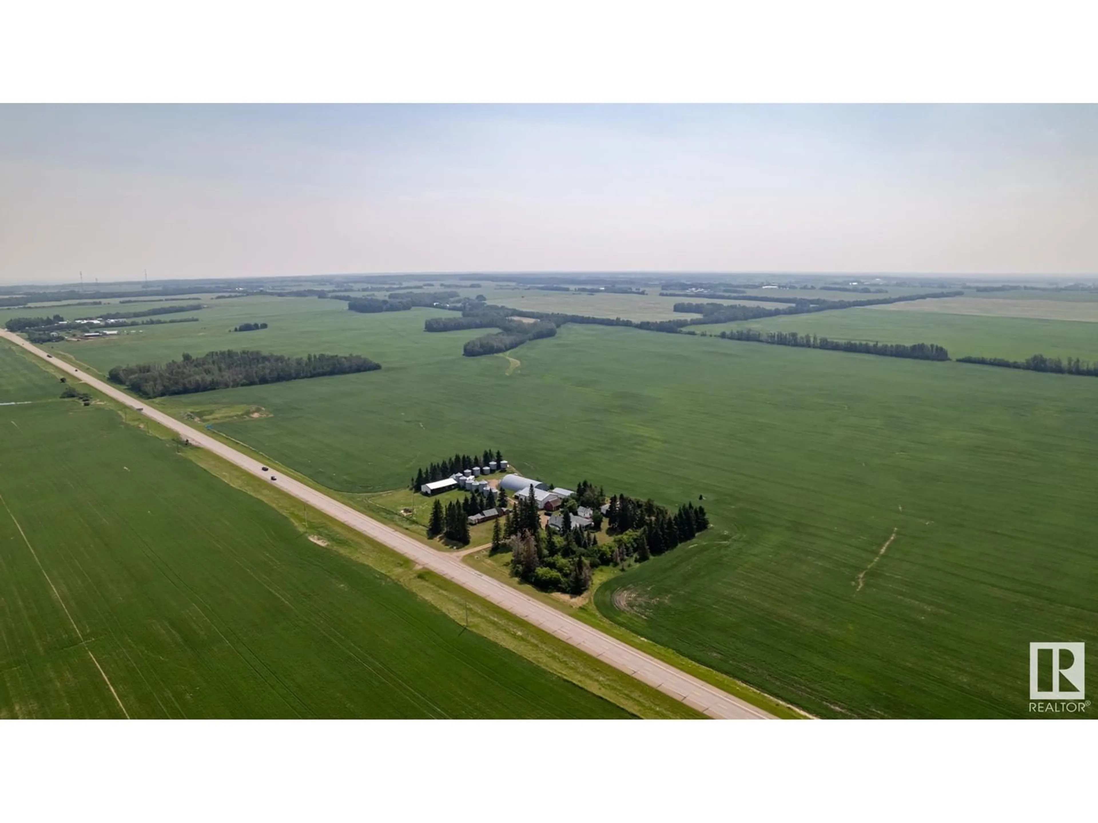 A pic from outside/outdoor area/front of a property/back of a property/a pic from drone, unknown for 20469 HWY 15, Rural Strathcona County Alberta T8L4B1