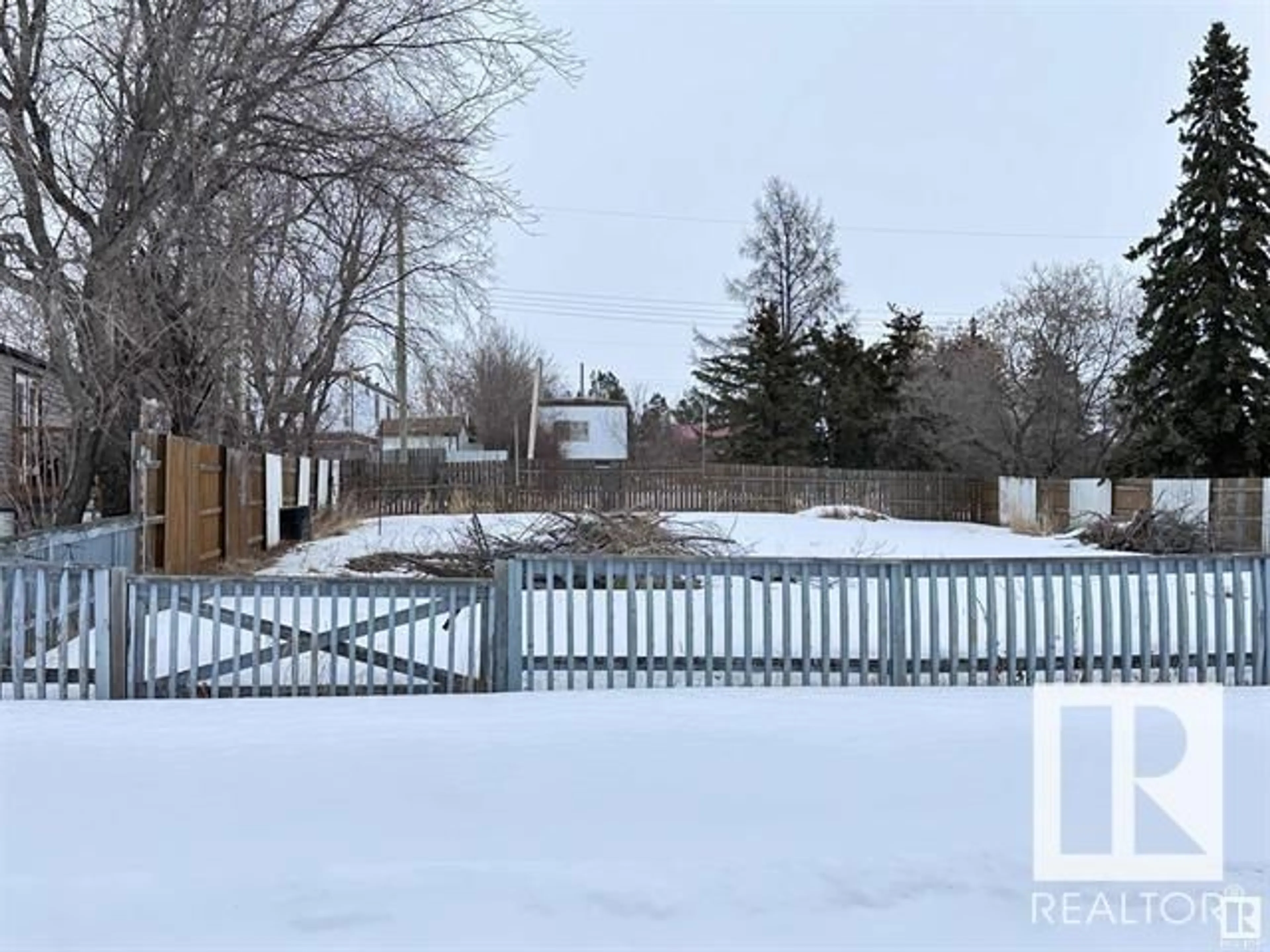 Frontside or backside of a home, the fenced backyard for 4813 52 ST, Busby Alberta T0G0H0