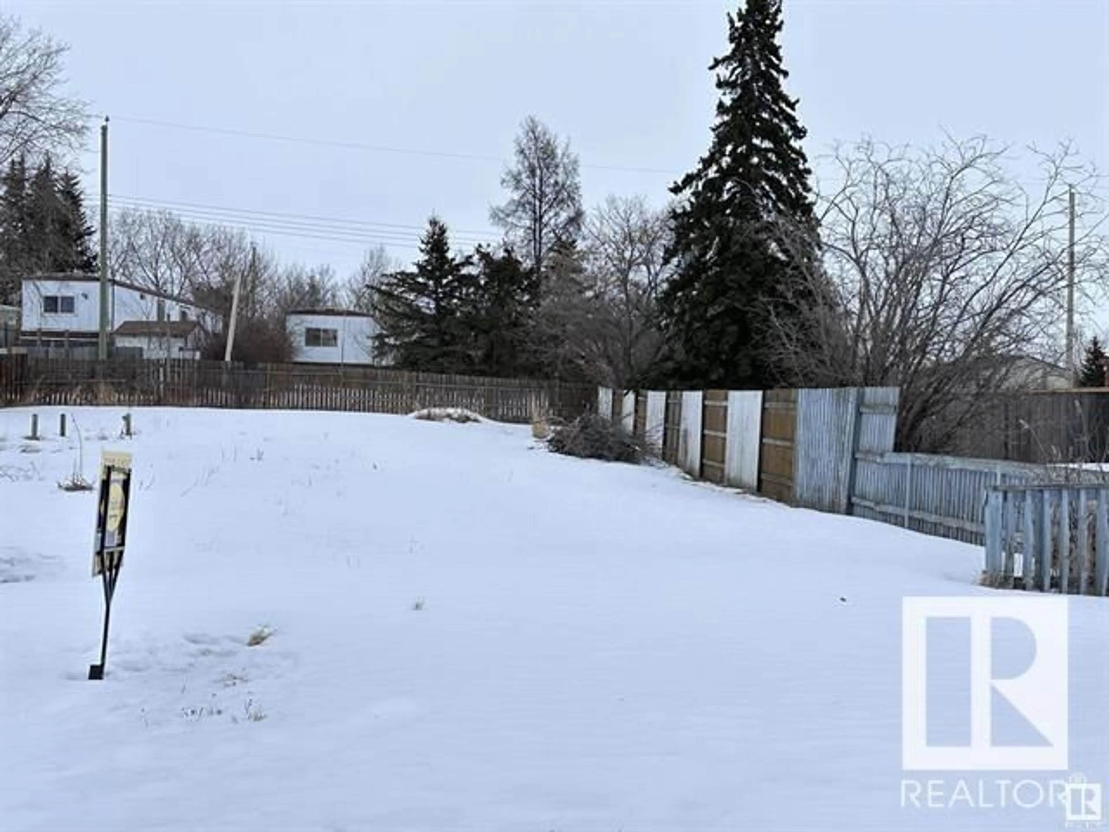 Frontside or backside of a home, the fenced backyard for 4815 52 ST, Busby Alberta T0G0H0