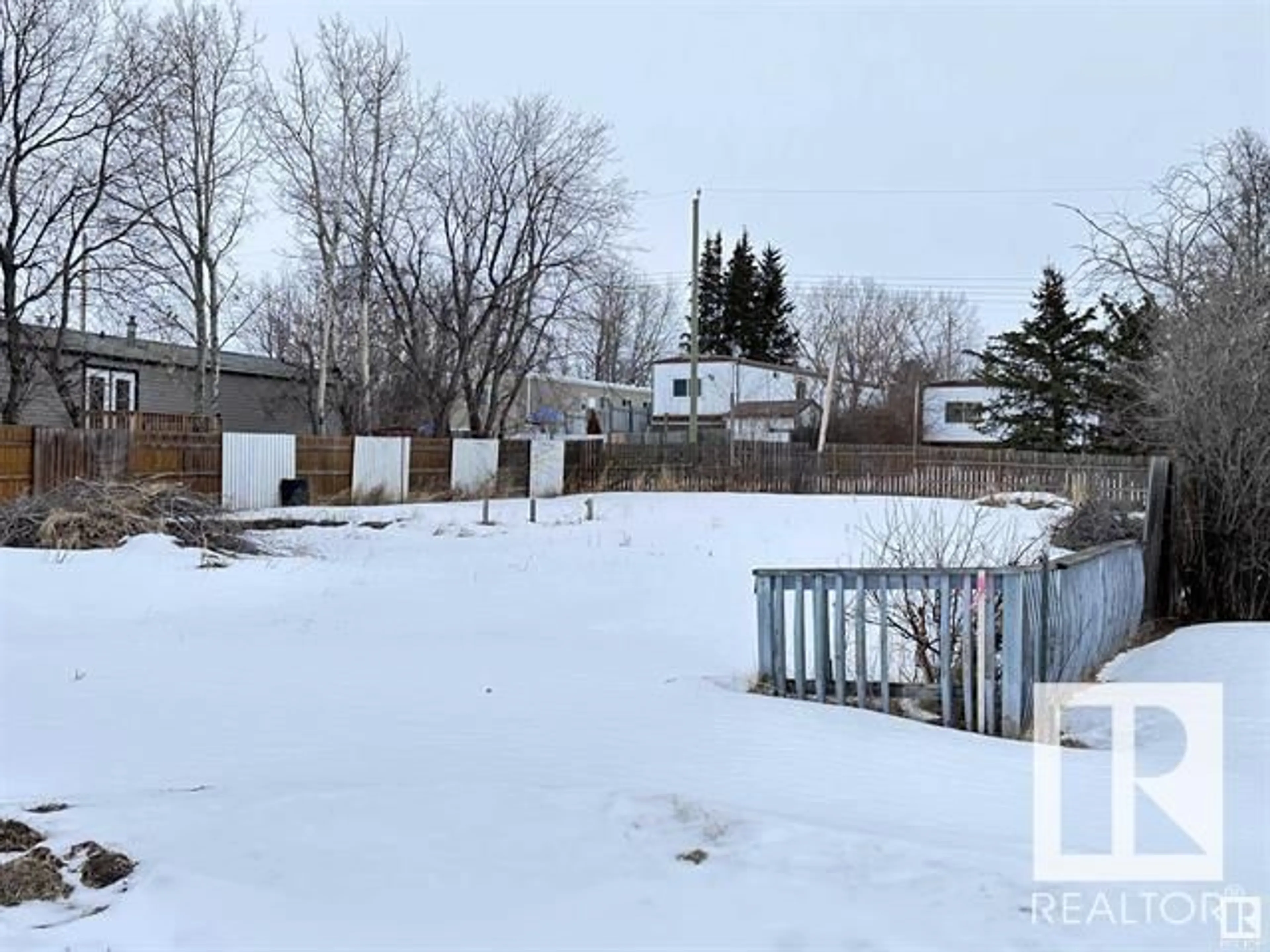 Frontside or backside of a home, the fenced backyard for 4815 52 ST, Busby Alberta T0G0H0