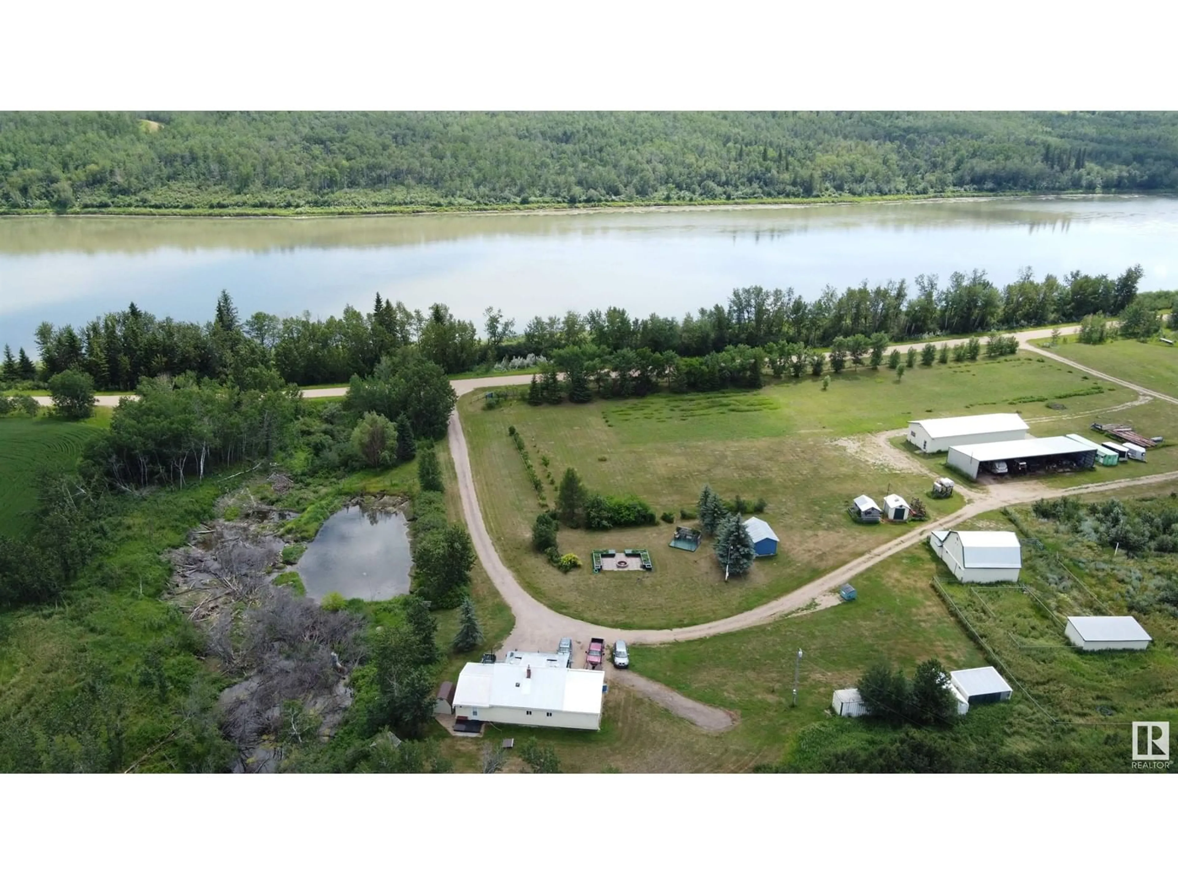A pic from outside/outdoor area/front of a property/back of a property/a pic from drone, water/lake/river/ocean view for 7308 TWP RD 562, Rural St. Paul County Alberta T0A1A0
