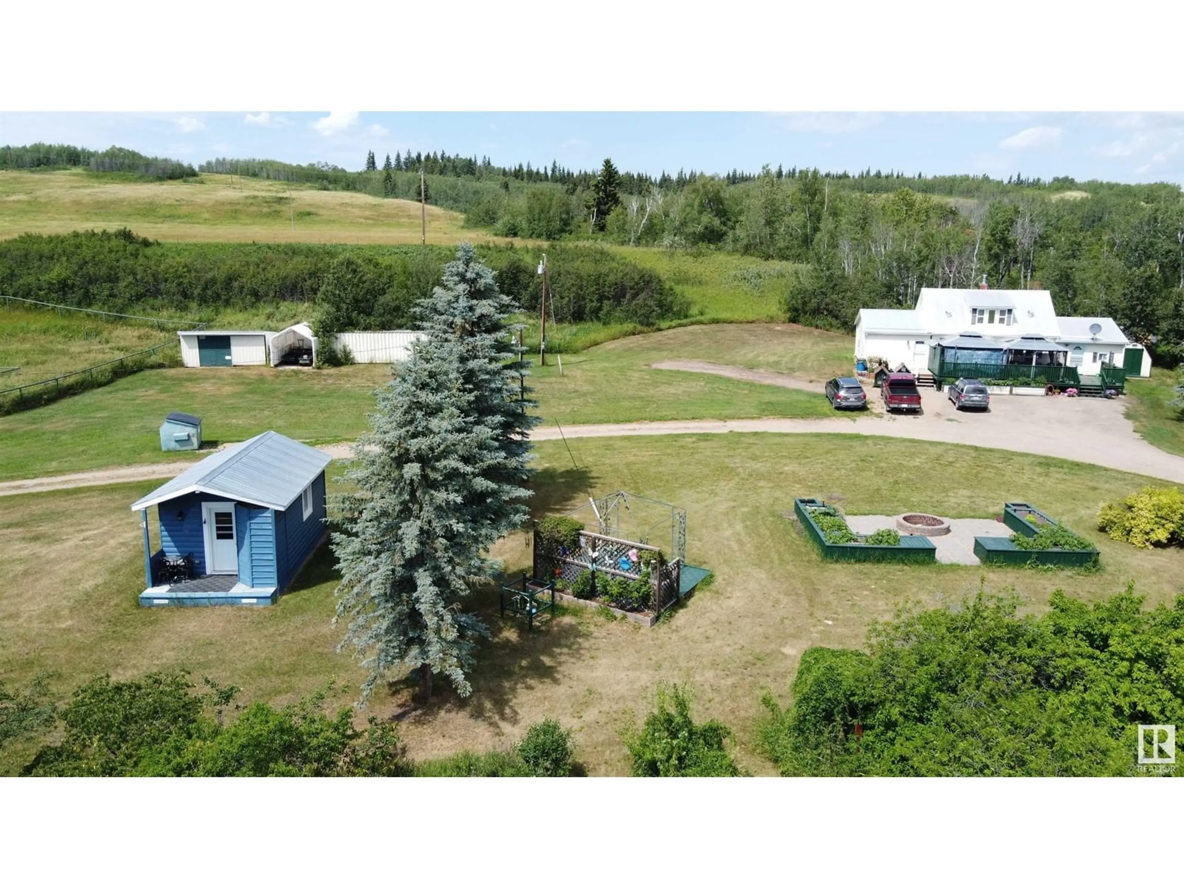 A pic from outside/outdoor area/front of a property/back of a property/a pic from drone, mountain view for 7308 TWP RD 562, Rural St. Paul County Alberta T0A1A0
