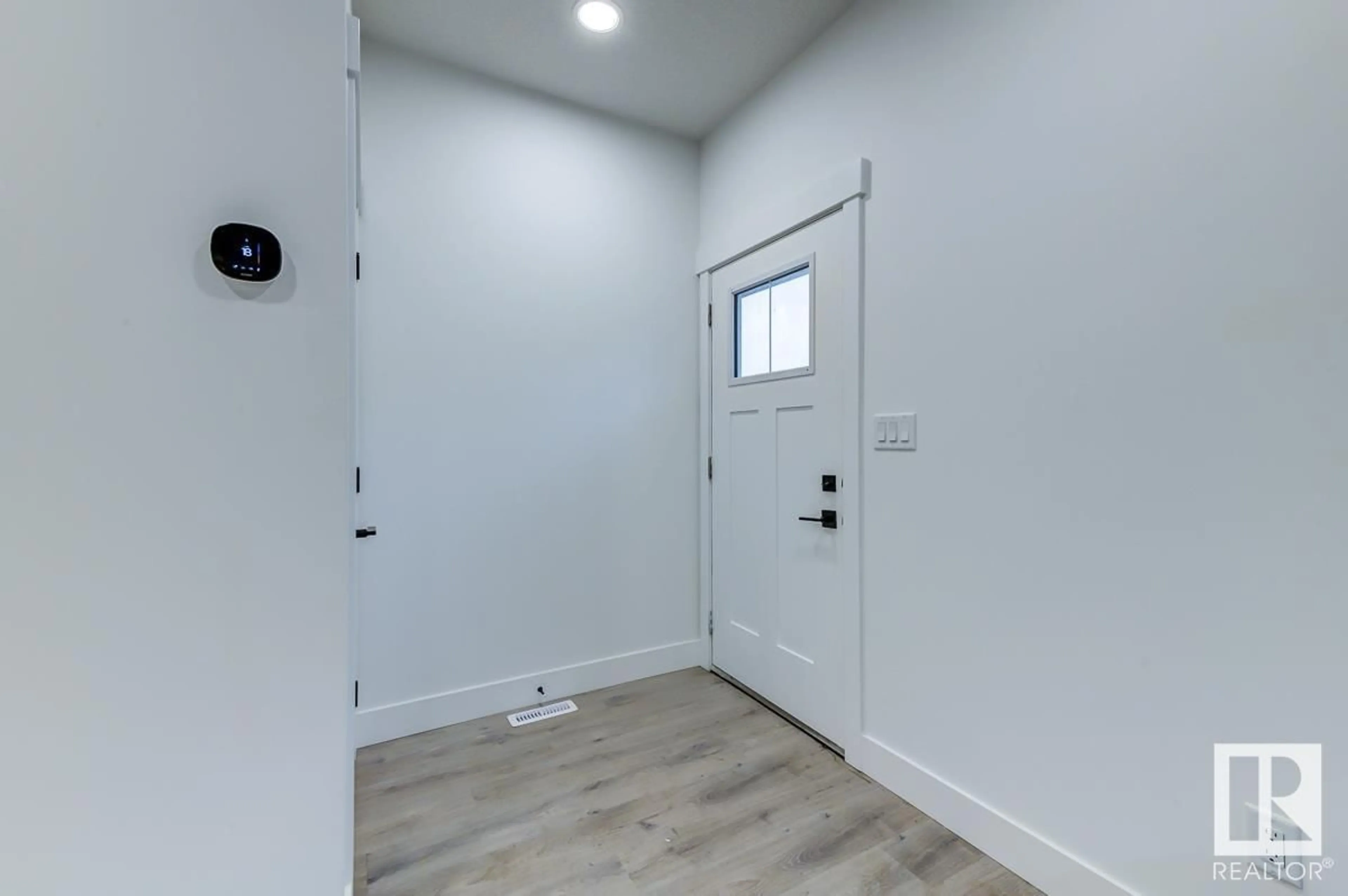 Indoor entryway for 13207 112 AV NW, Edmonton Alberta T5M2R9