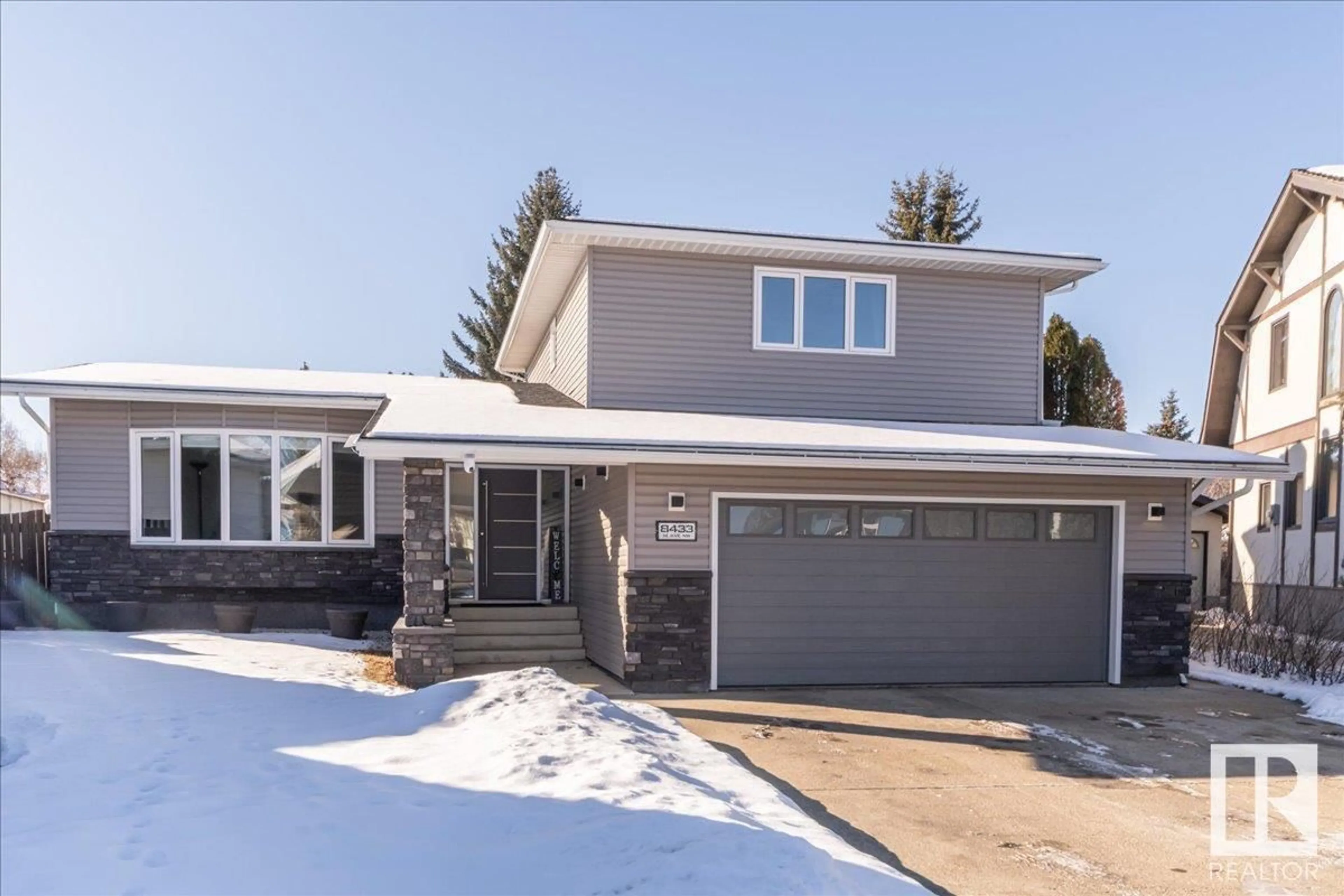 Frontside or backside of a home for 8433 14 AV NW, Edmonton Alberta T6K1X3
