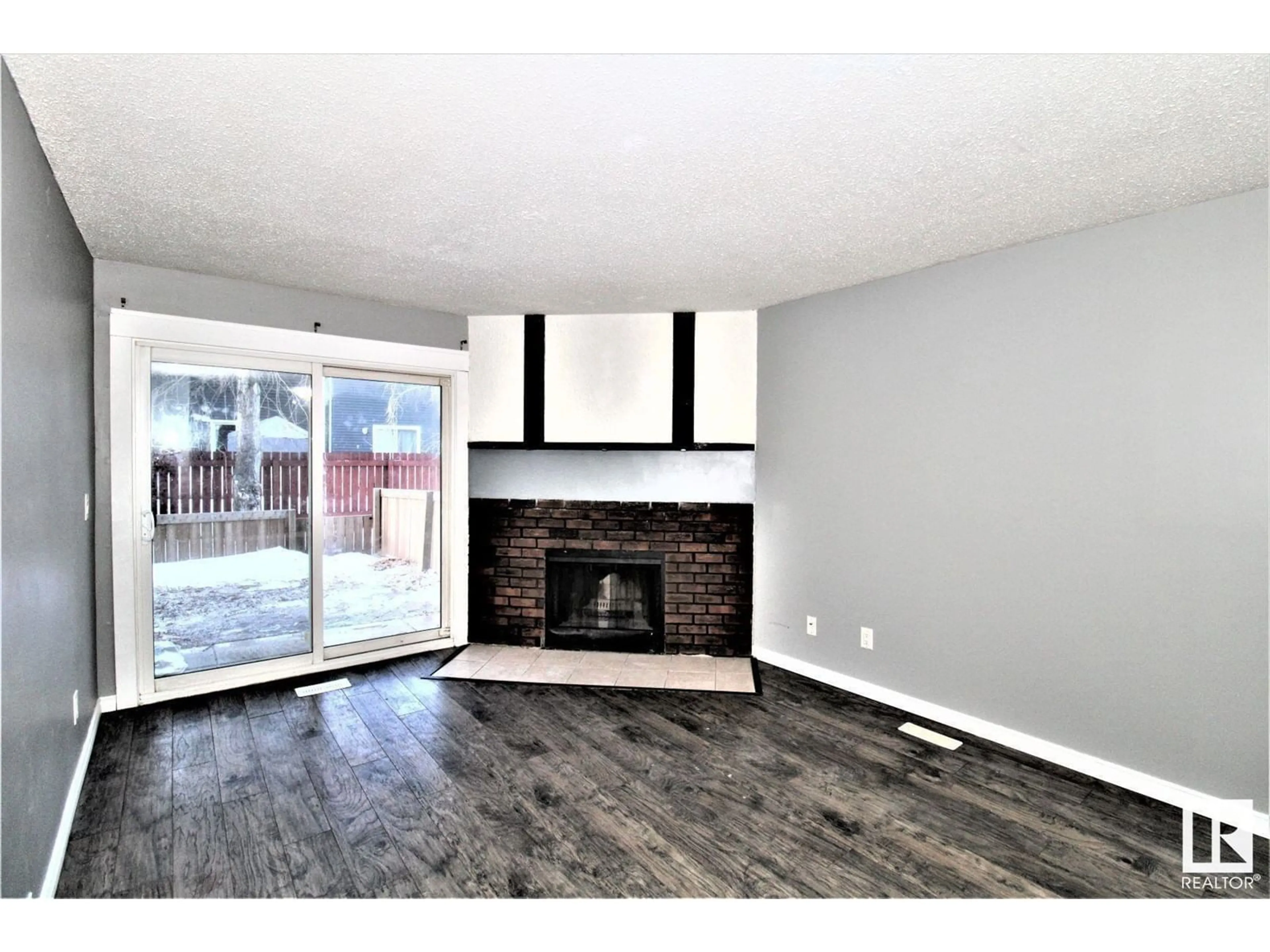 Living room, wood floors for #101 12408 161 AV NW, Edmonton Alberta T5X4W6