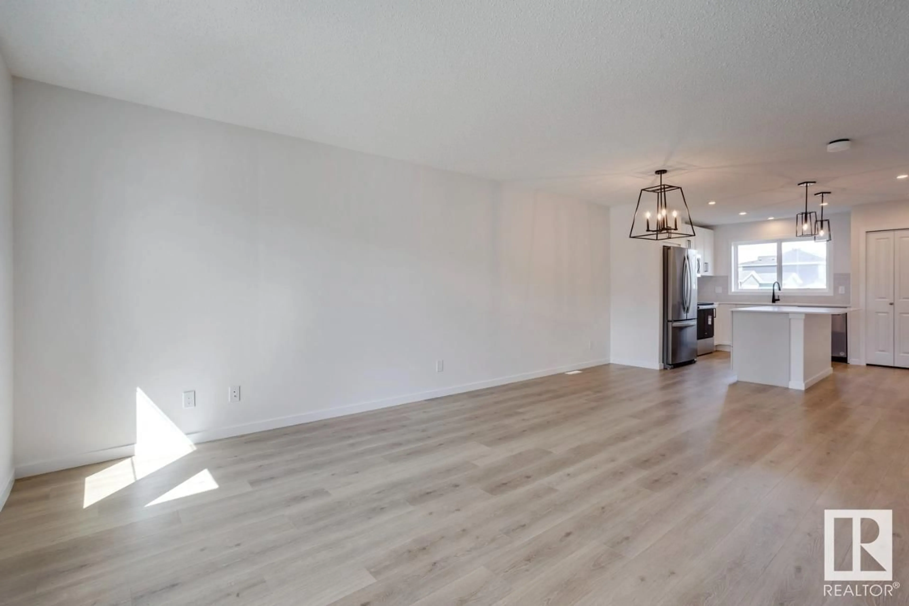 A pic of a room, wood floors for 115 Stiles LI, Leduc Alberta T9E1N9