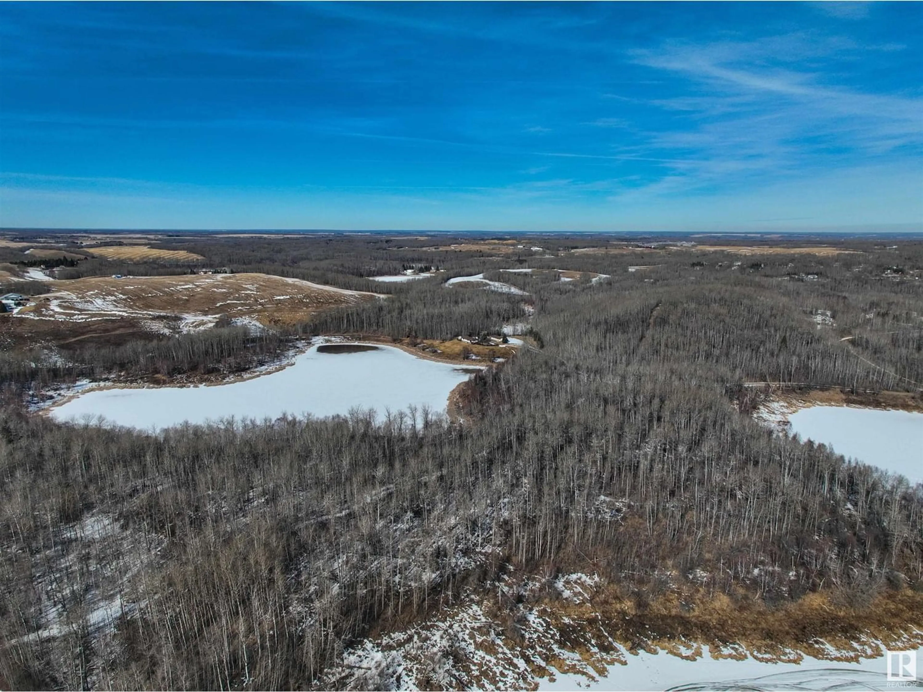 A pic from outside/outdoor area/front of a property/back of a property/a pic from drone, water/lake/river/ocean view for 53512 RGE RD 13, Rural Parkland County Alberta T7Y0H7