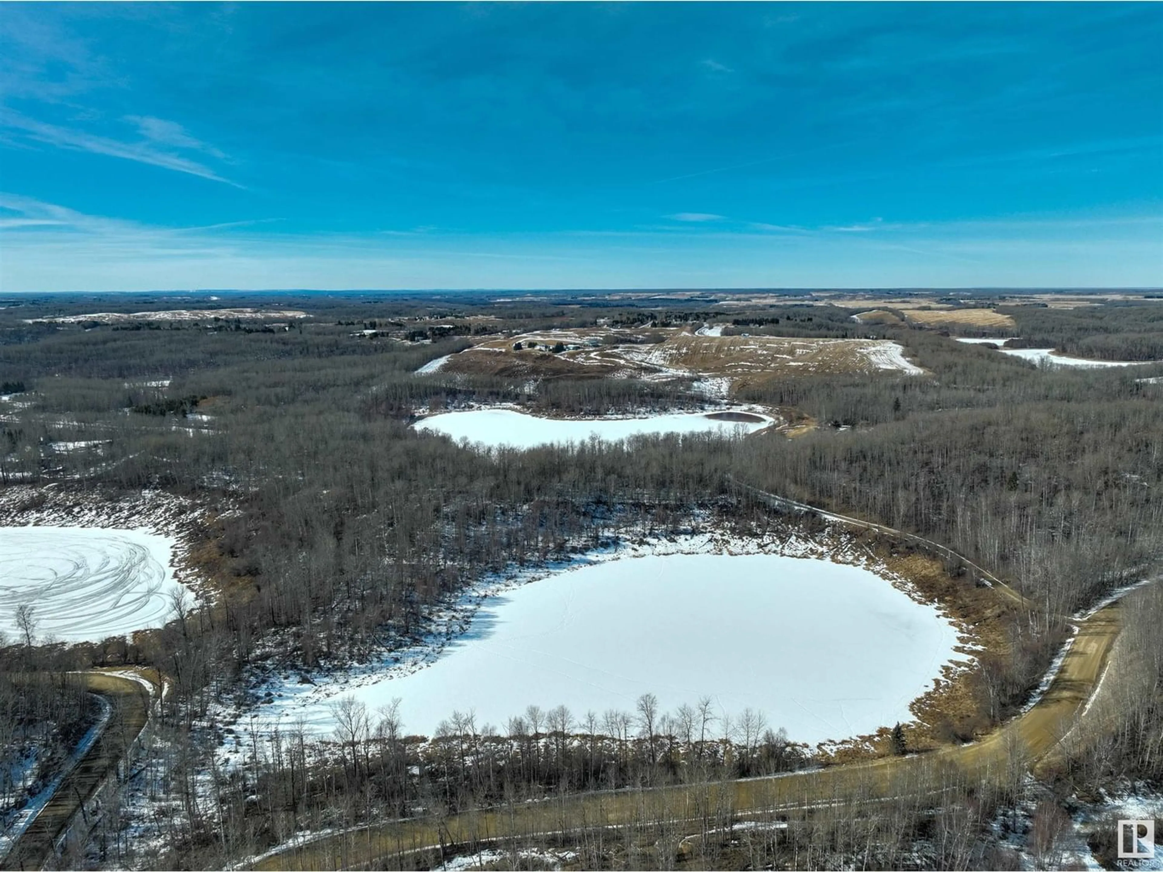 A pic from outside/outdoor area/front of a property/back of a property/a pic from drone, water/lake/river/ocean view for 53512 RGE RD 13, Rural Parkland County Alberta T7Y0H7