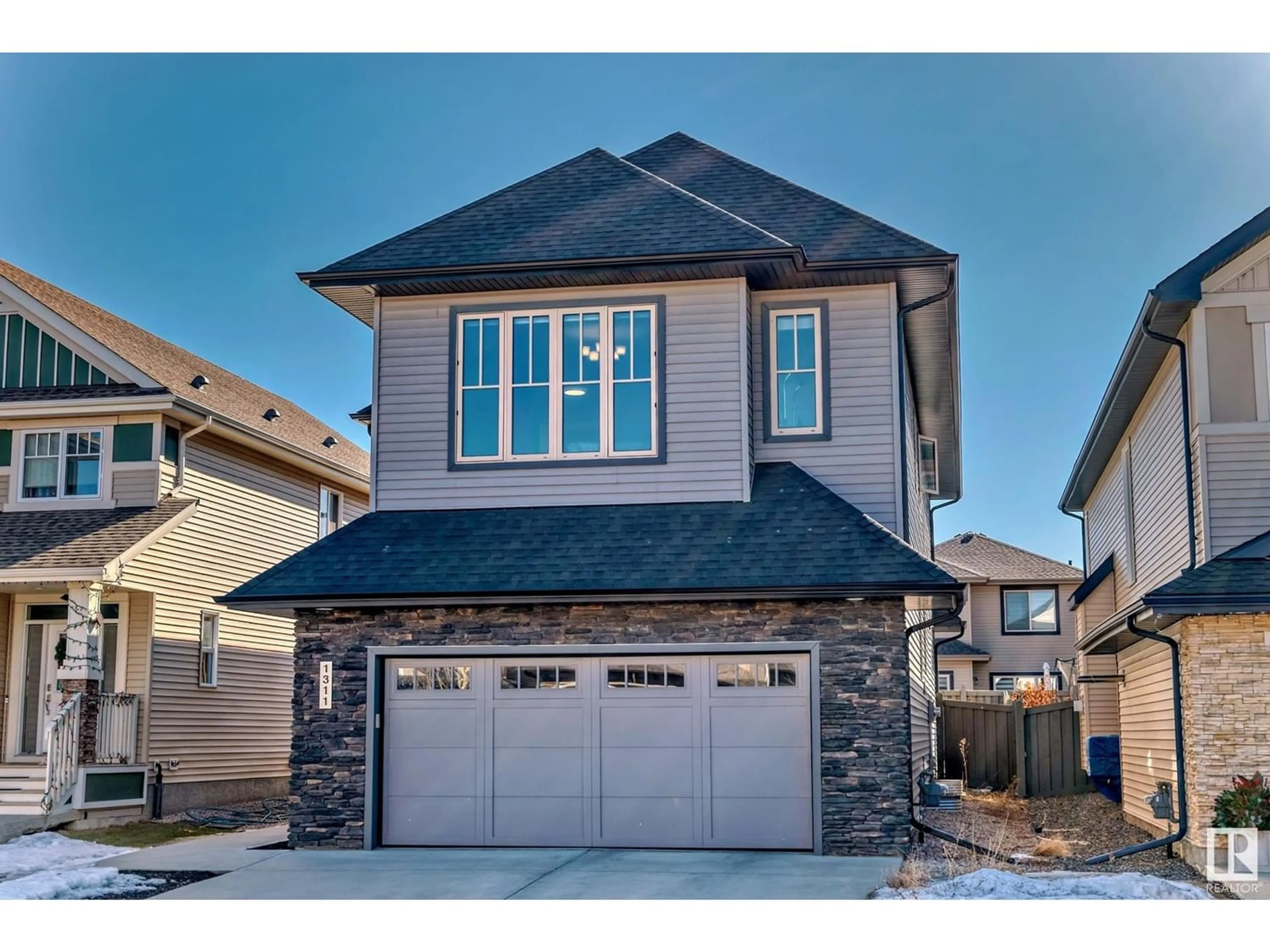 Frontside or backside of a home for 1311 Ainslie WD SW, Edmonton Alberta T6W3G1