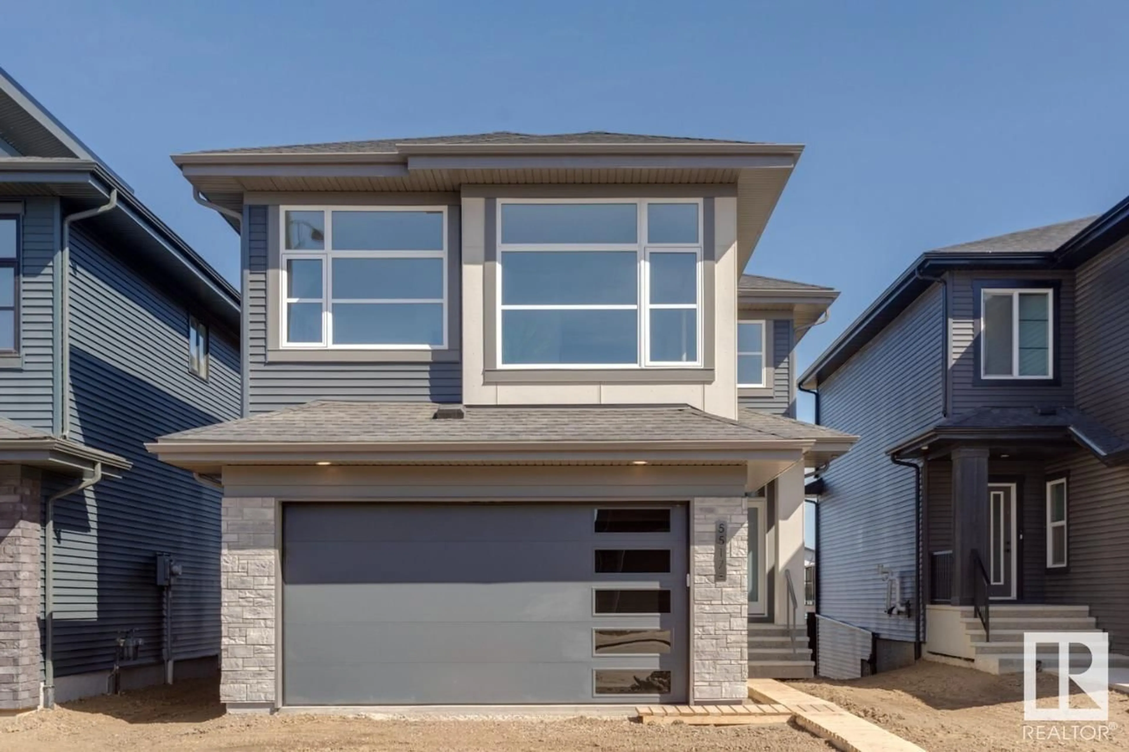 Home with vinyl exterior material for 5517 KOOTOOK RD SW, Edmonton Alberta T6W1A6