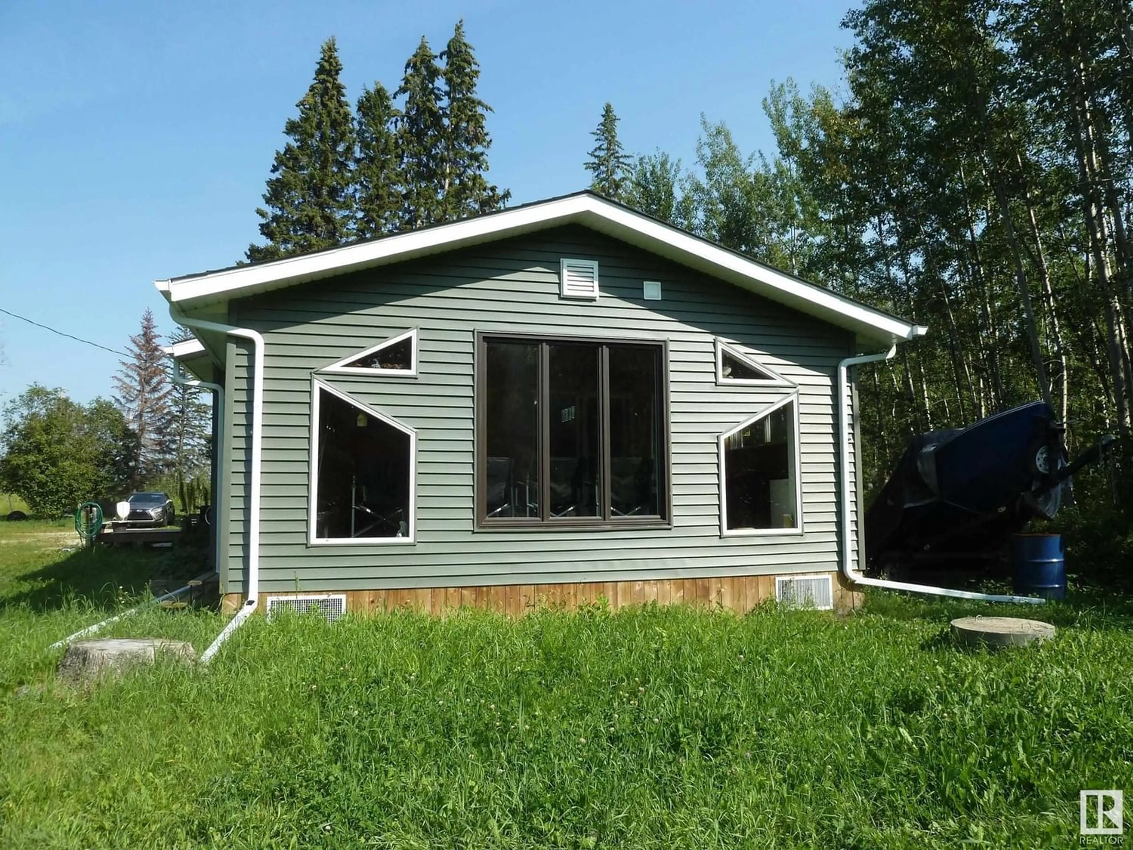 Frontside or backside of a home for 55118 RGE RD 33, Rural Lac Ste. Anne County Alberta T0E1A0