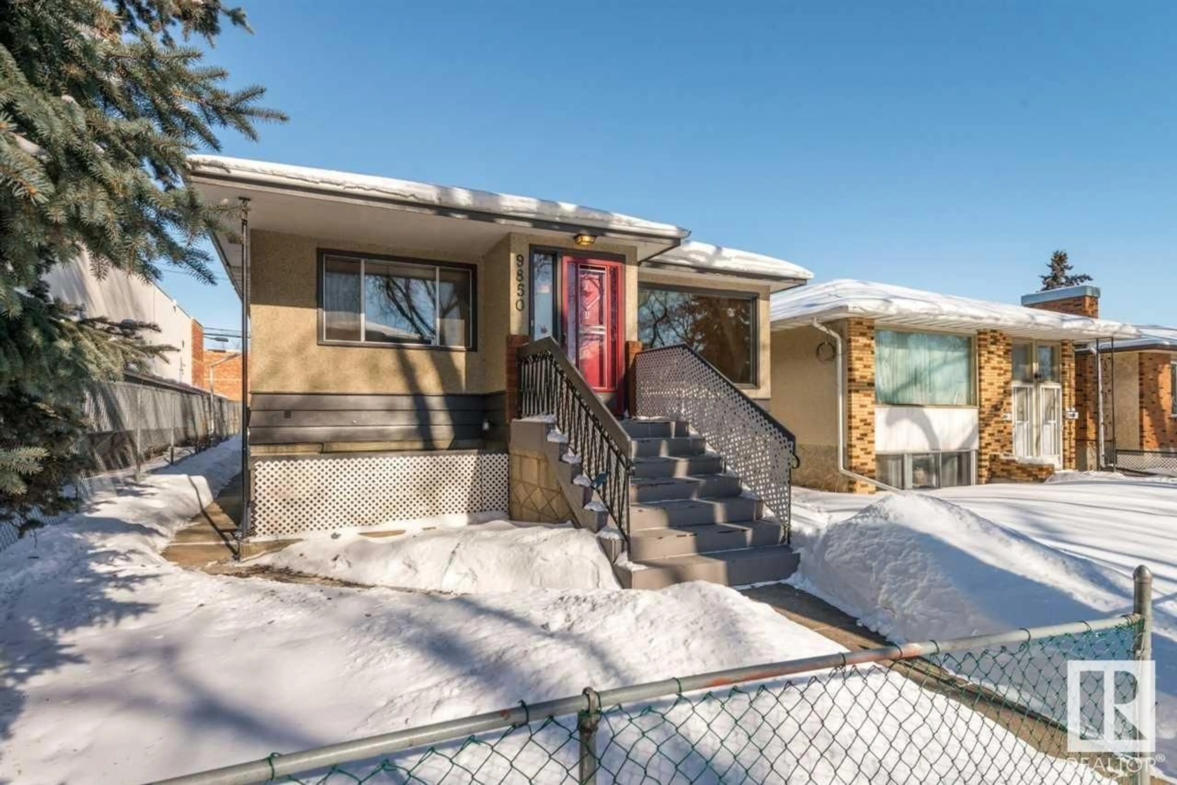 Frontside or backside of a home for 9850 81 AV NW, Edmonton Alberta T6E1W4