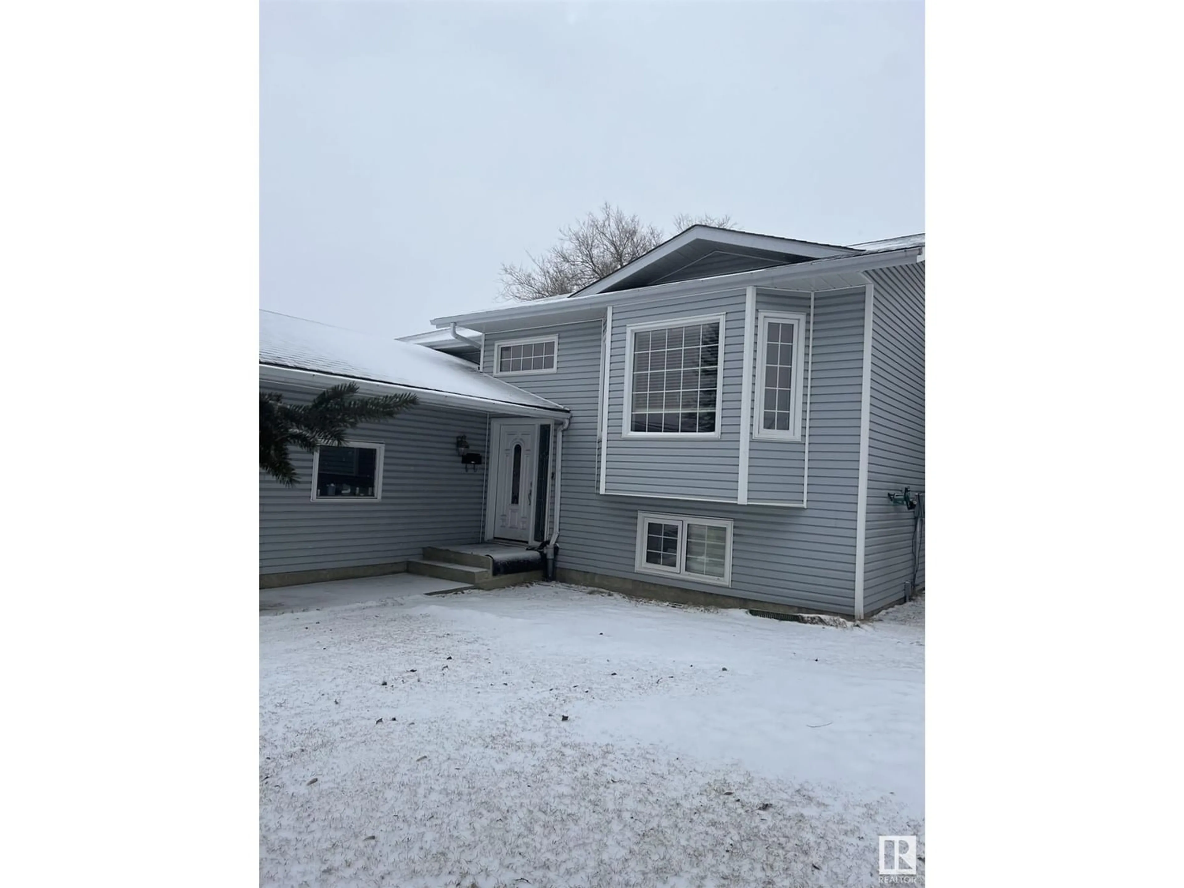 Frontside or backside of a home for 4103 19 AV NW, Edmonton Alberta T6L3C6