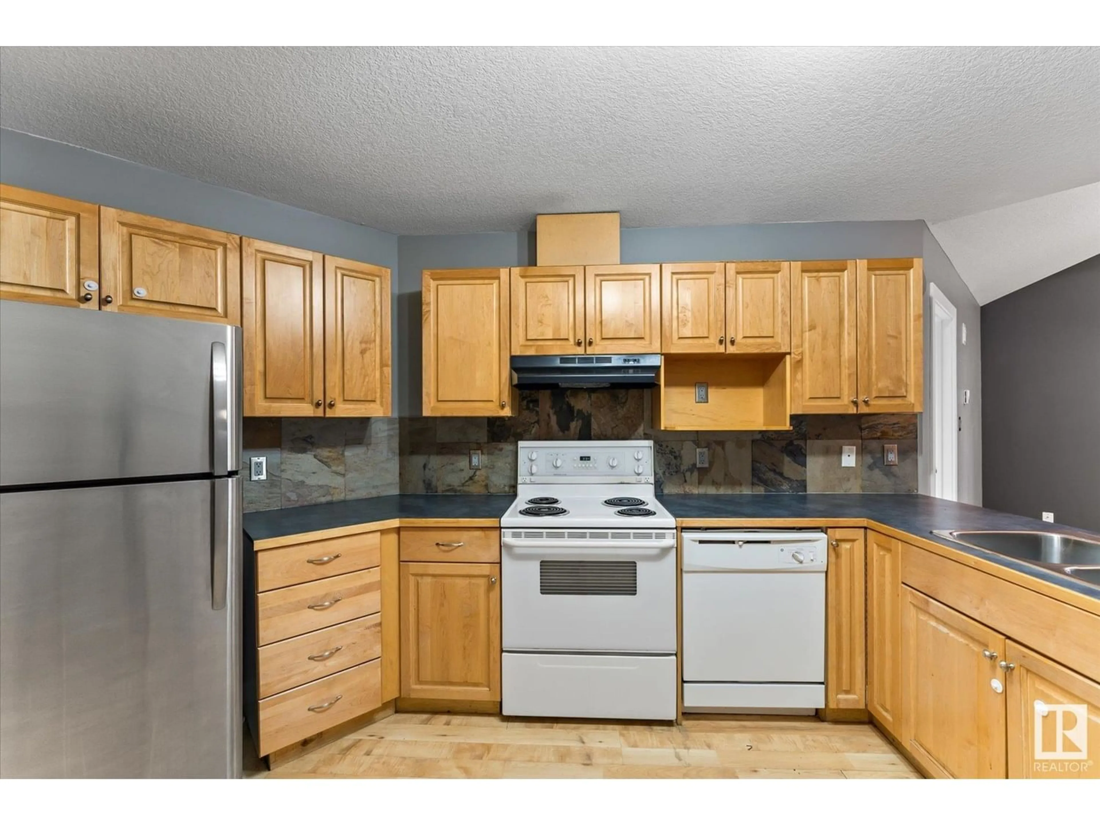 Standard kitchen, wood floors, cottage for #204 9336 JASPER AV NW, Edmonton Alberta T5H3T5