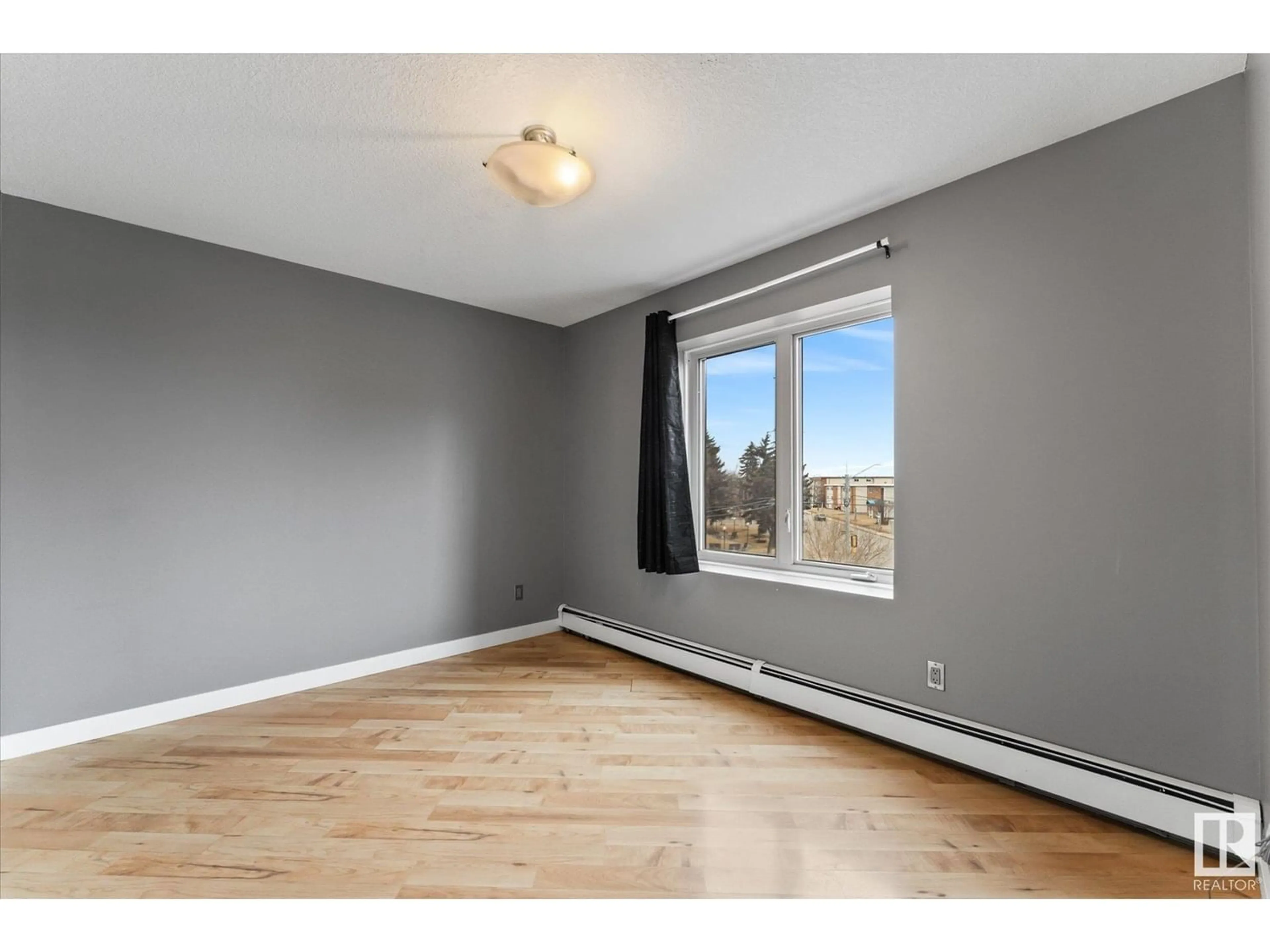 A pic of a room, wood floors for #205 9336 JASPER AV NW, Edmonton Alberta T5H3T5