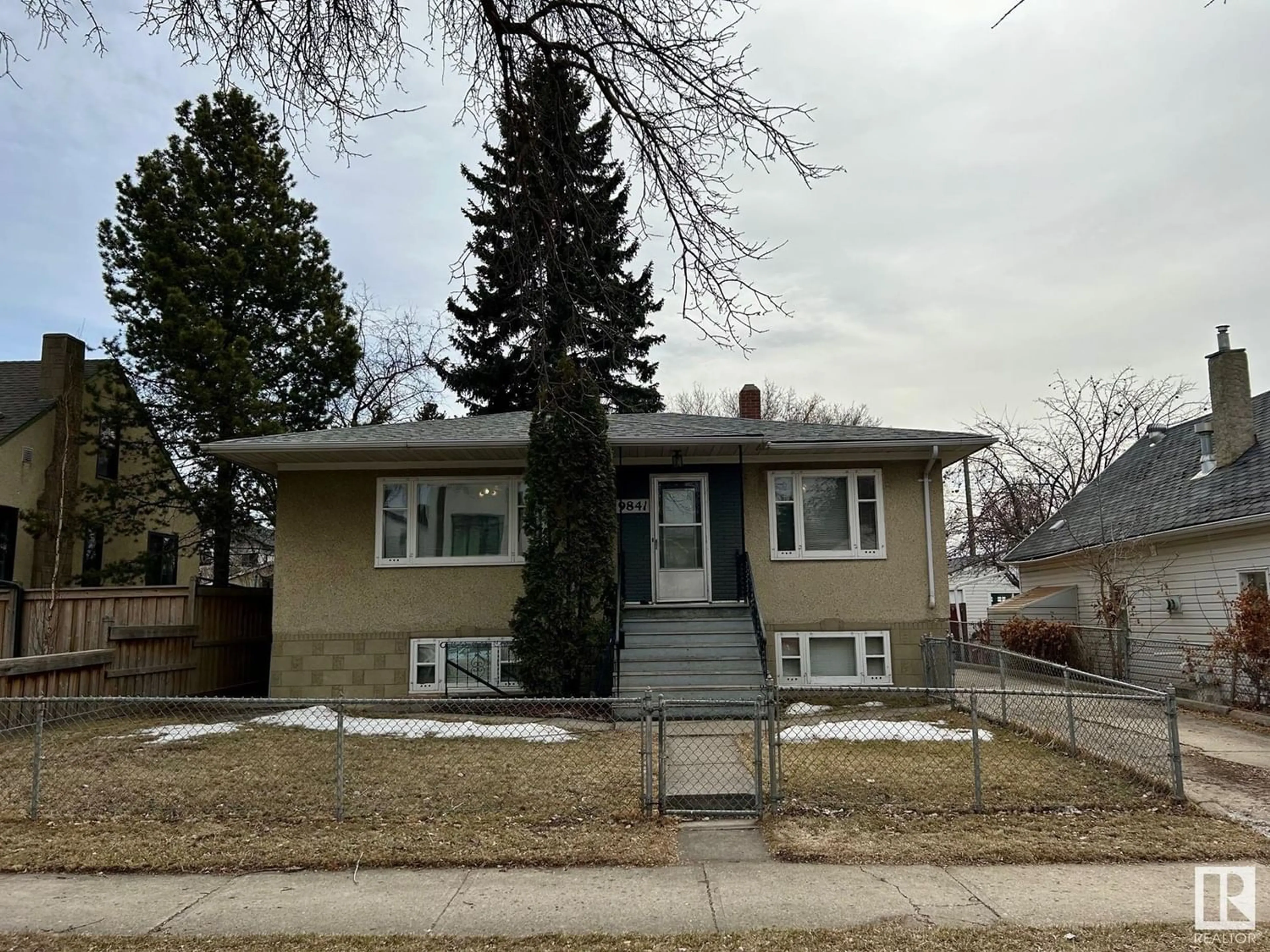 Frontside or backside of a home for 9841 74 AV NW, Edmonton Alberta T6E1G1