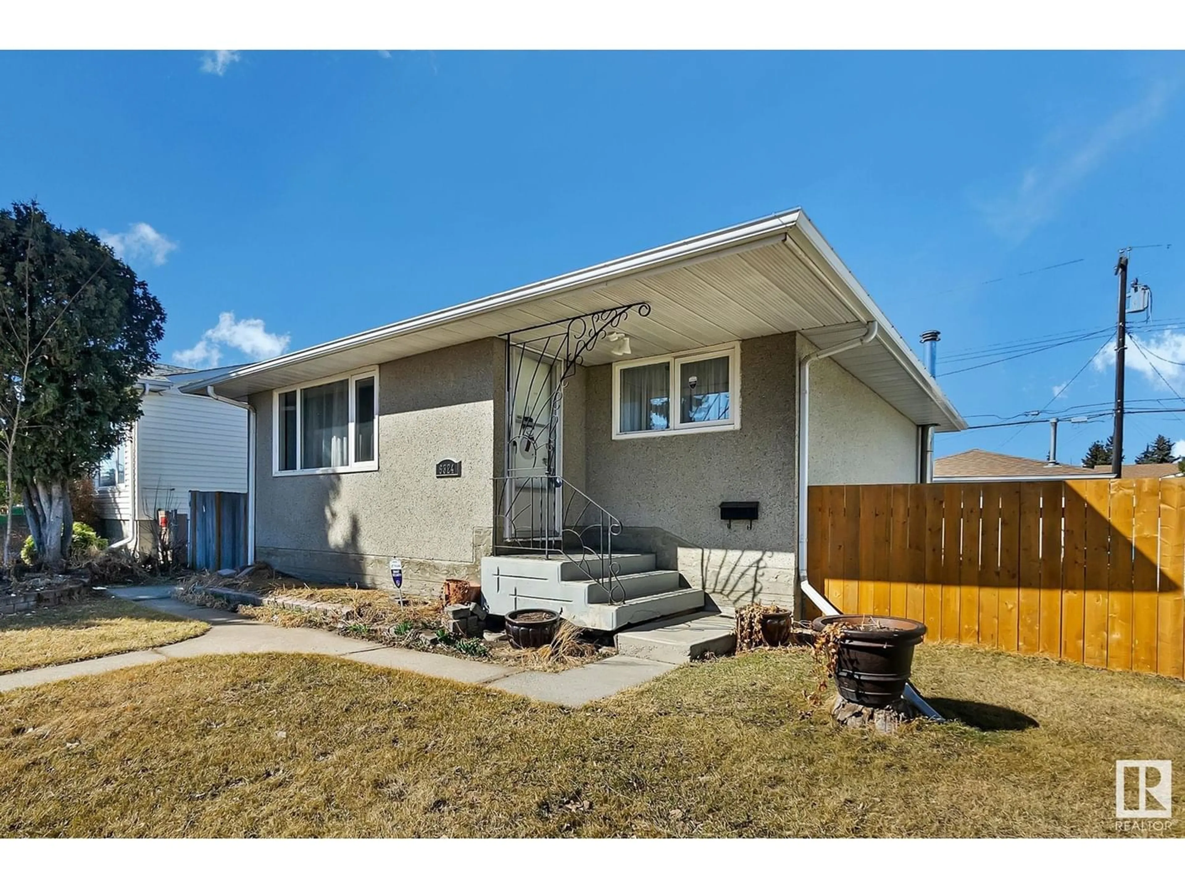 Frontside or backside of a home for 6324 132 AV NW, Edmonton Alberta T5A0J7