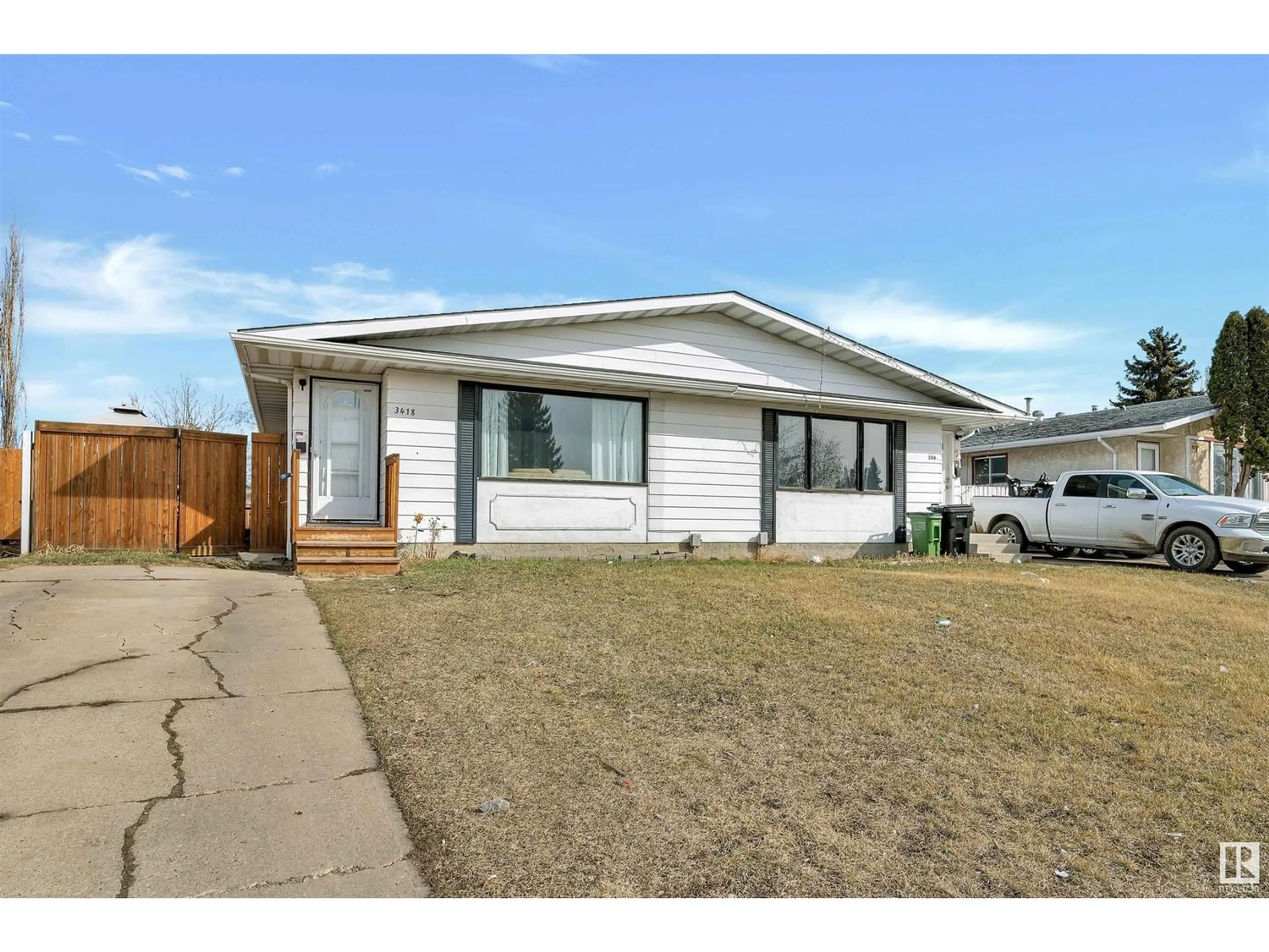 Frontside or backside of a home for 3418 135 AV NW, Edmonton Alberta T5A2V7