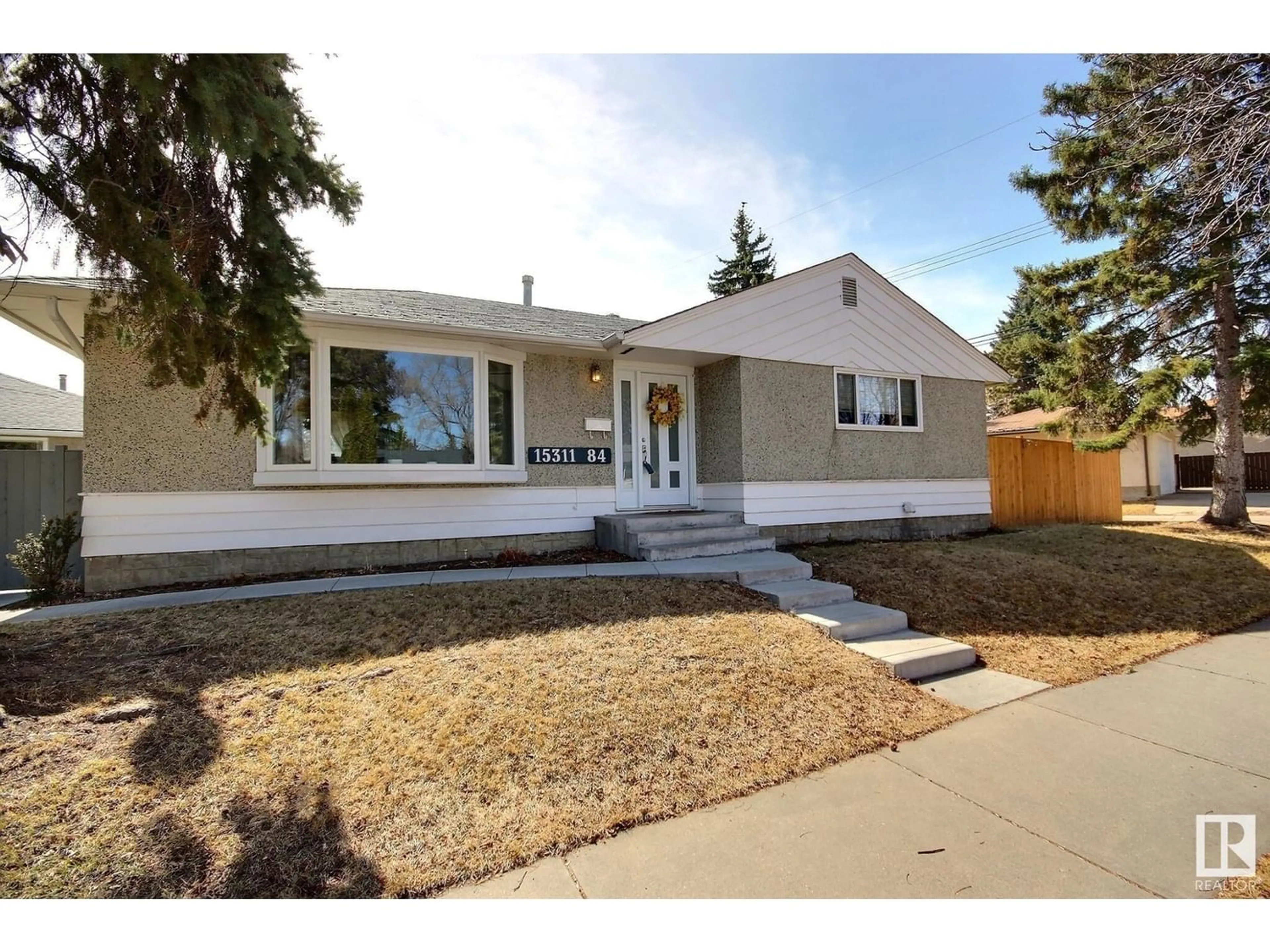 Frontside or backside of a home for 15311 84 AV NW, Edmonton Alberta T5R3X9