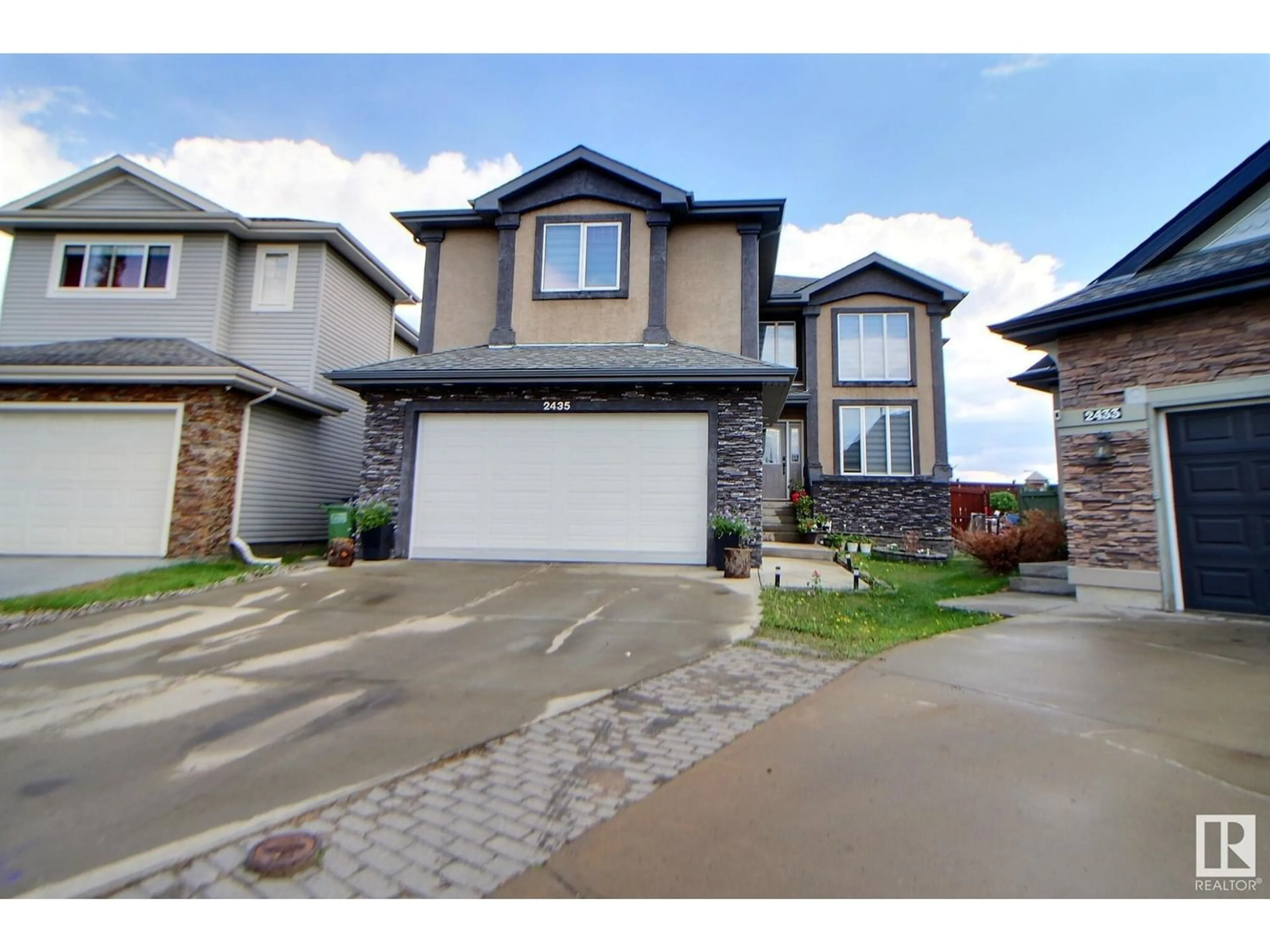 Frontside or backside of a home for 2435 HAGEN WY NW, Edmonton Alberta T6R3L5