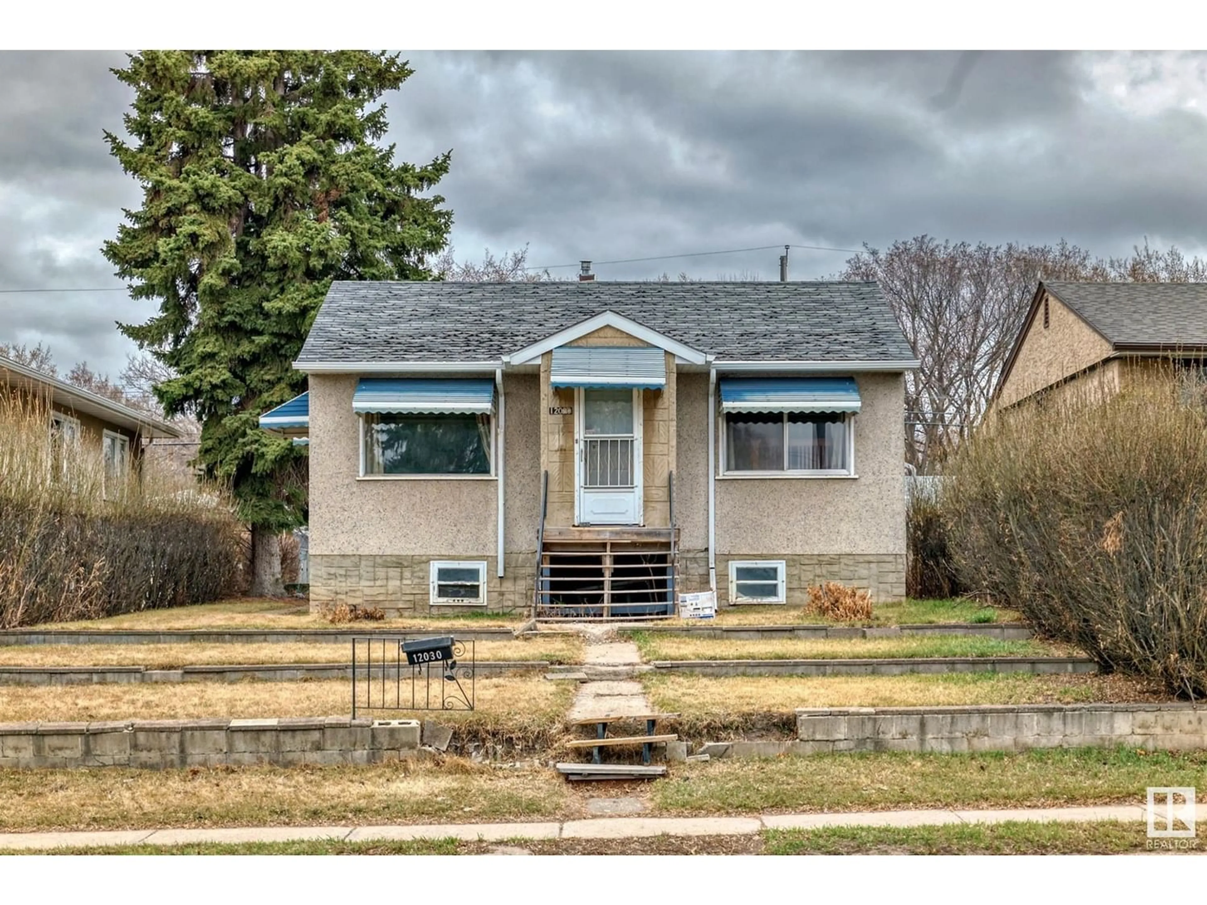 Frontside or backside of a home for 12030 50 ST NW NW, Edmonton Alberta T5W3C4