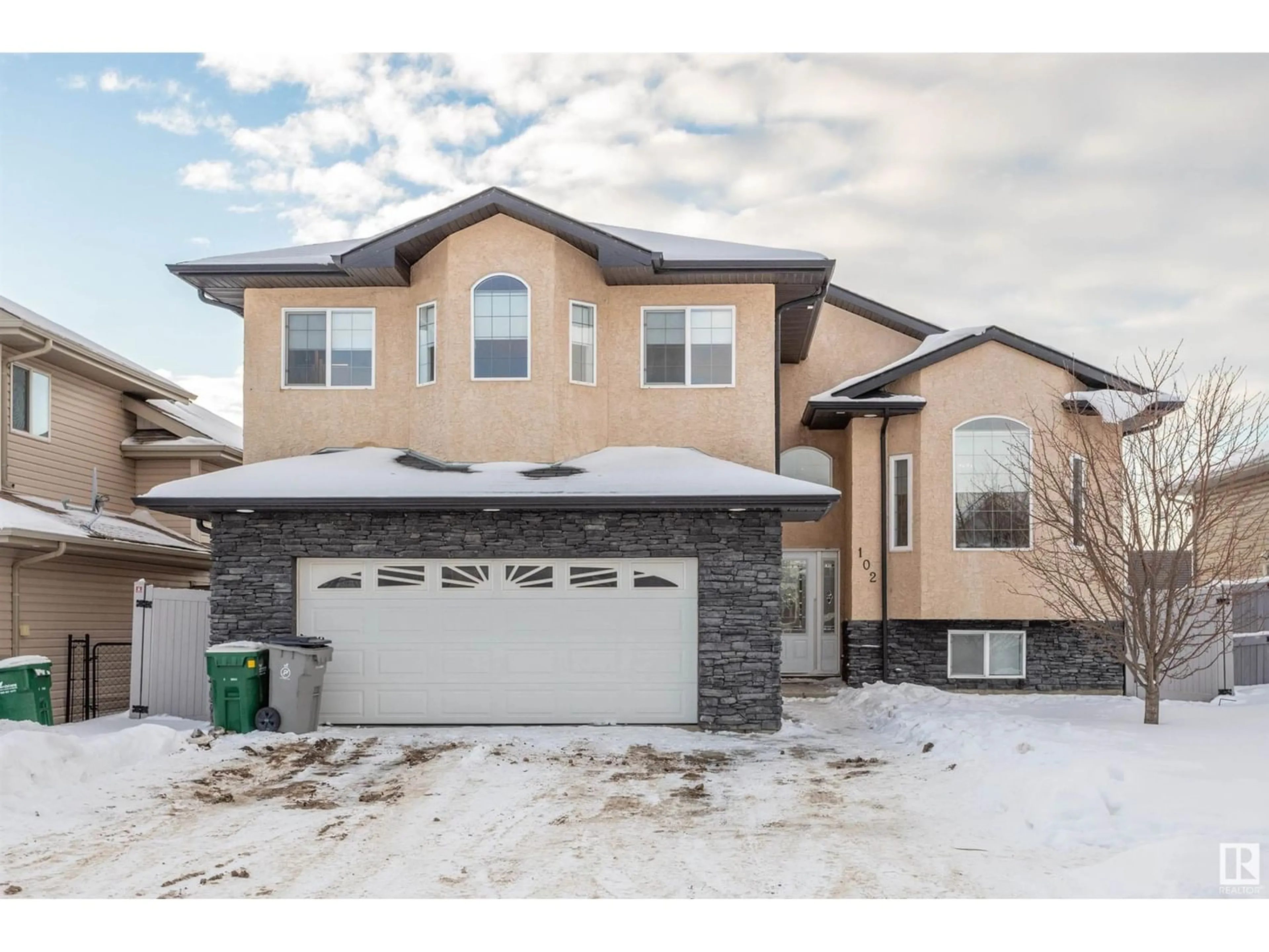 Frontside or backside of a home for 102 Houle DR, Morinville Alberta T8R0E1