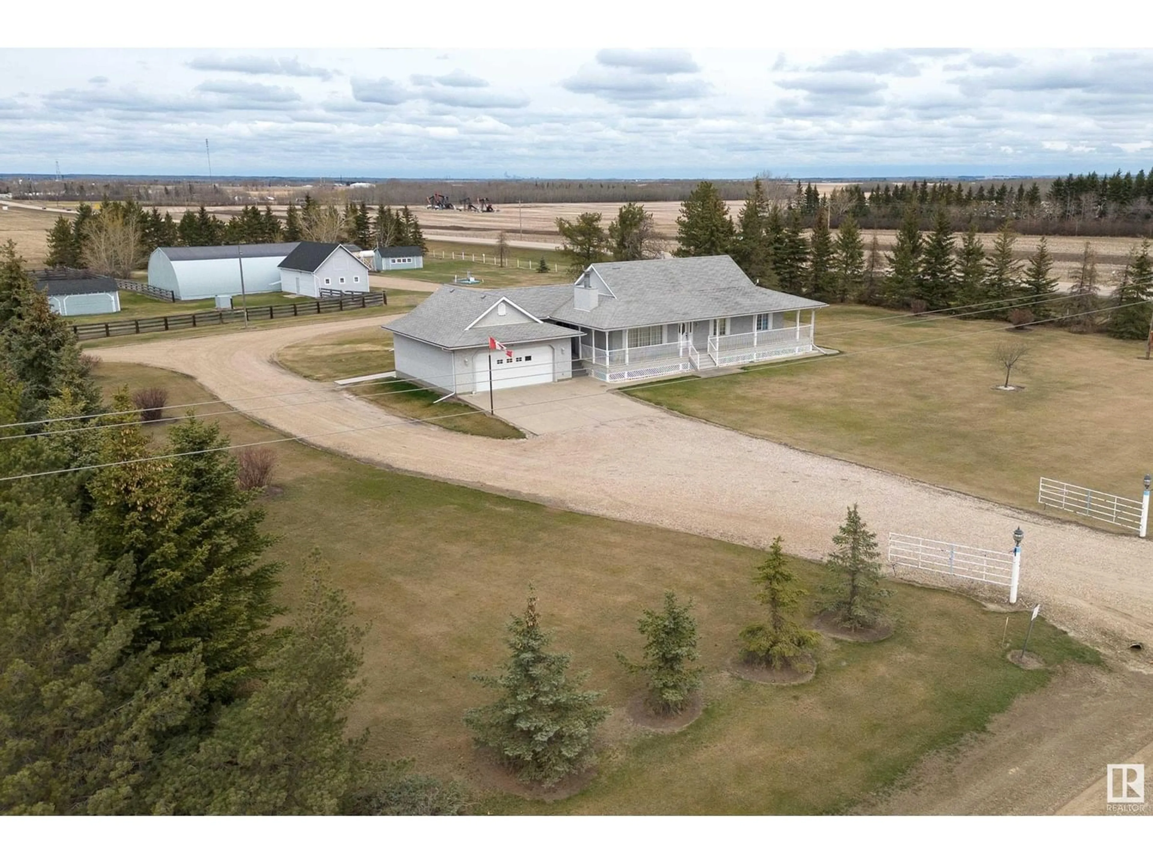 A pic from outside/outdoor area/front of a property/back of a property/a pic from drone, unknown for 26304 Twp Rd 502, Rural Leduc County Alberta T9G0G8