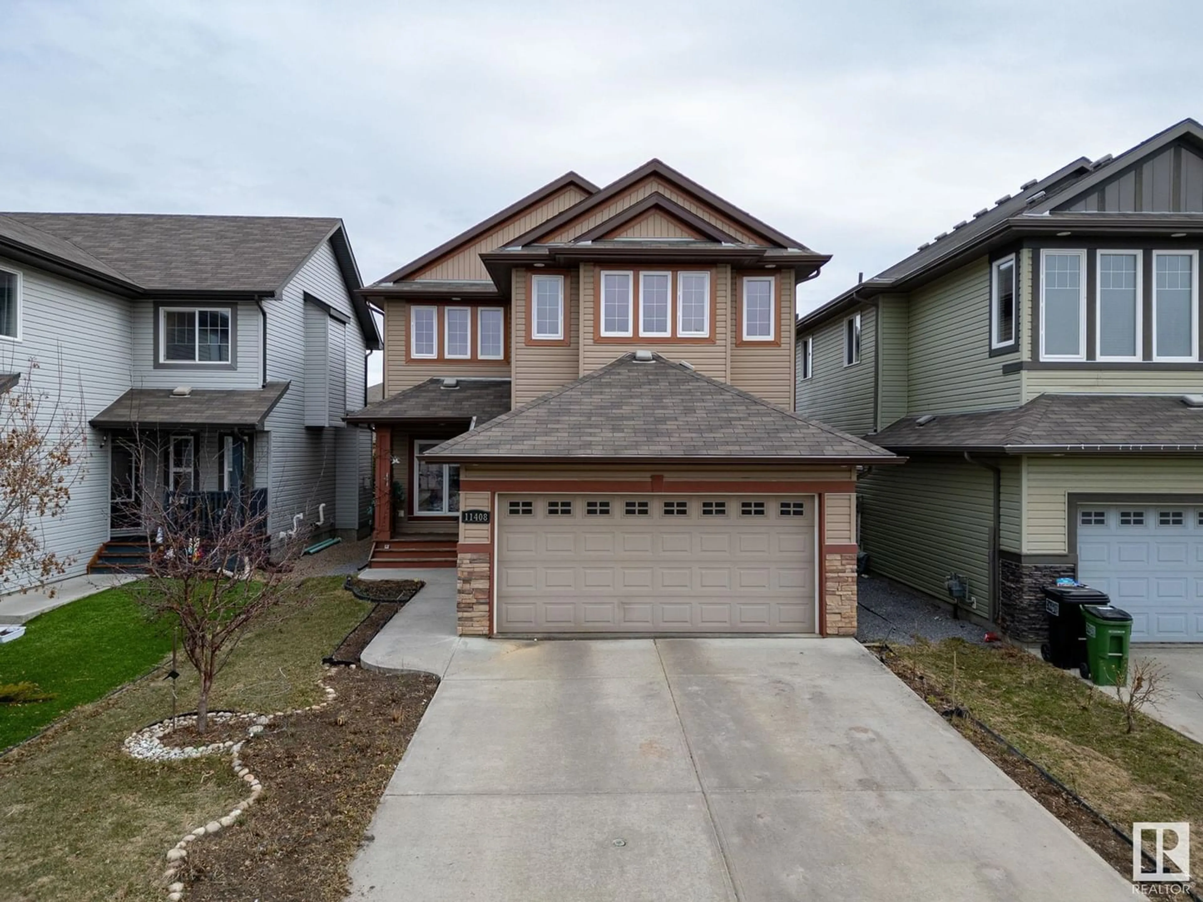Frontside or backside of a home for 11408 15 AV SW, Edmonton Alberta T6W0Z8