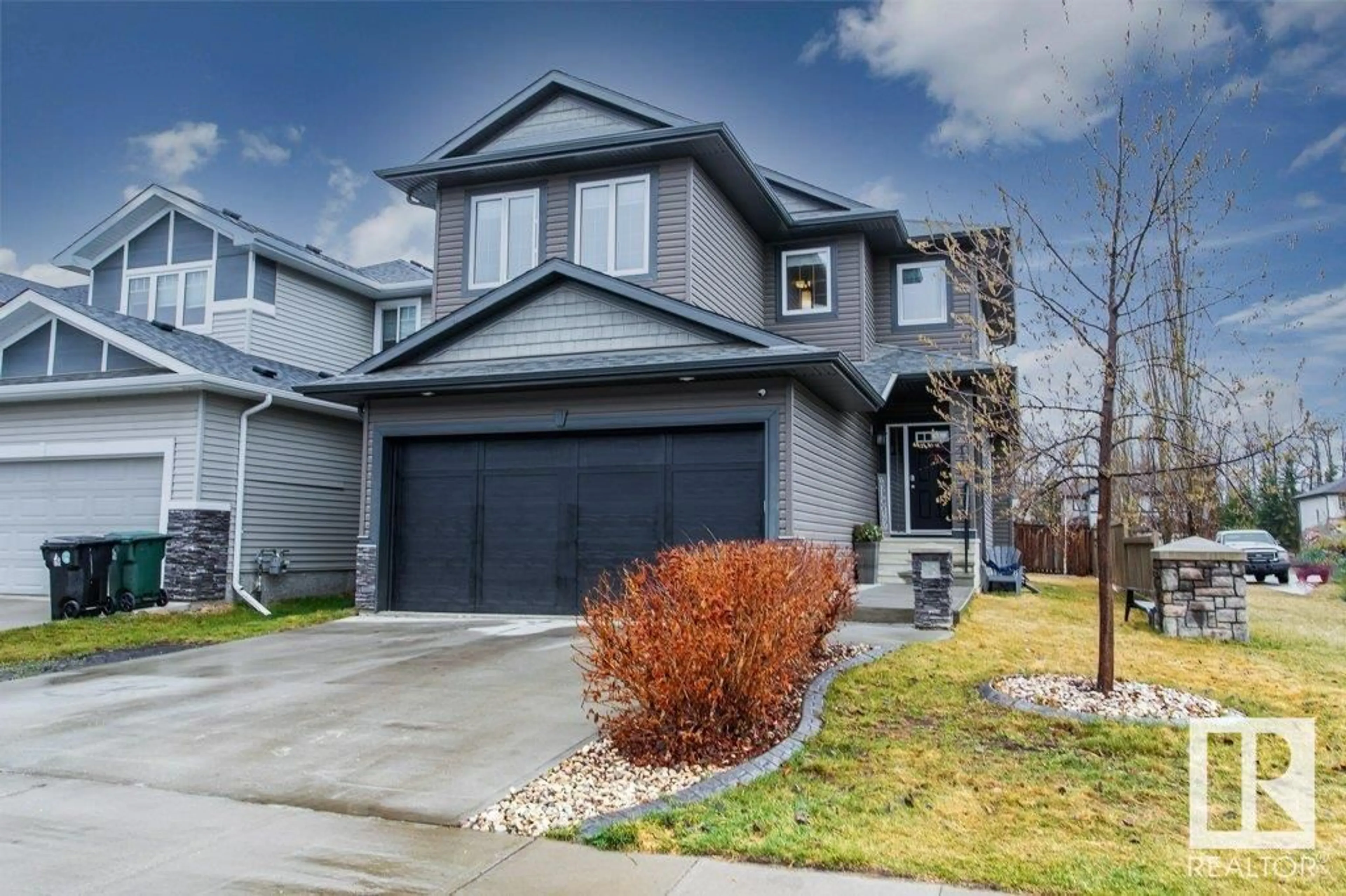 Frontside or backside of a home for 178 HARVEST DR, Spruce Grove Alberta T7X0P4