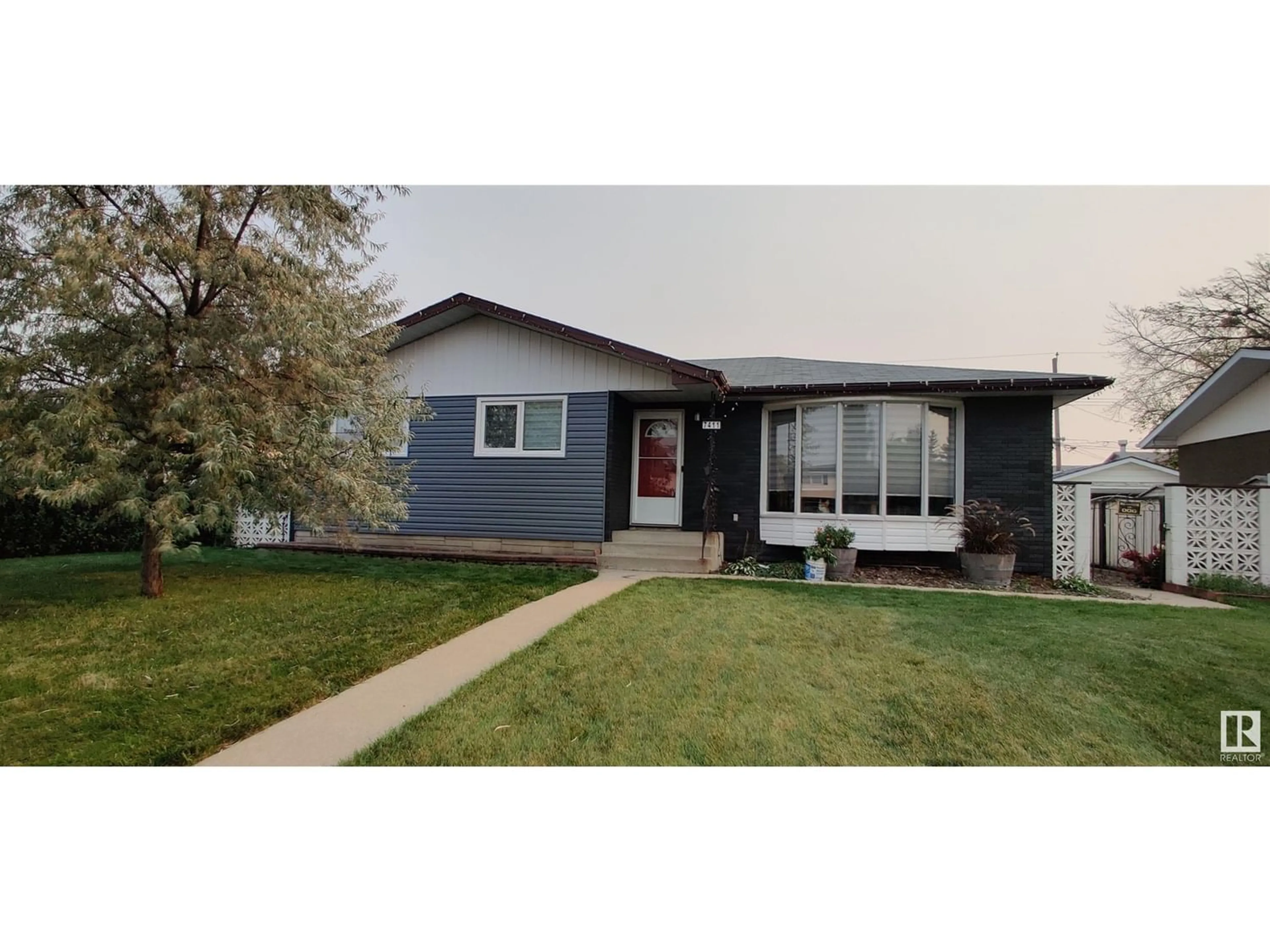 Frontside or backside of a home for 7411 84 AV NW, Edmonton Alberta T6B0H9