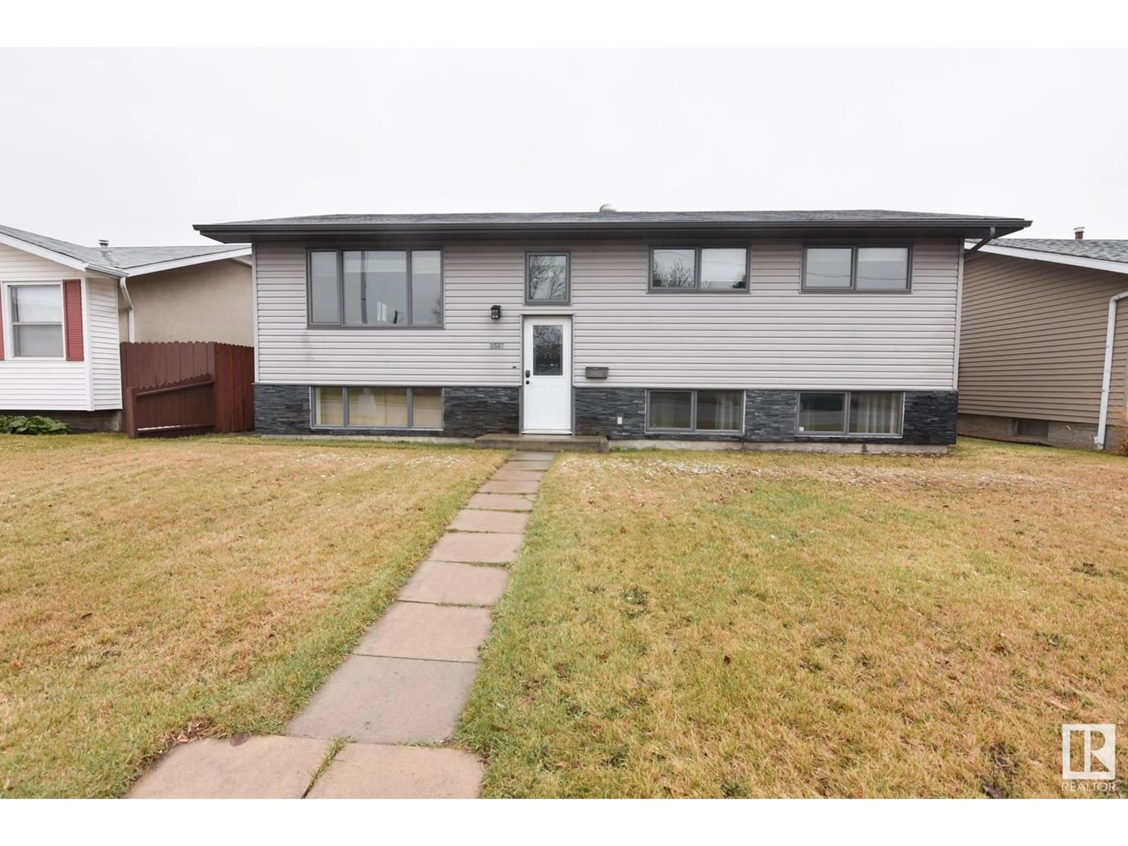 Frontside or backside of a home for 3507 106 AV NW, Edmonton Alberta T5W0C1