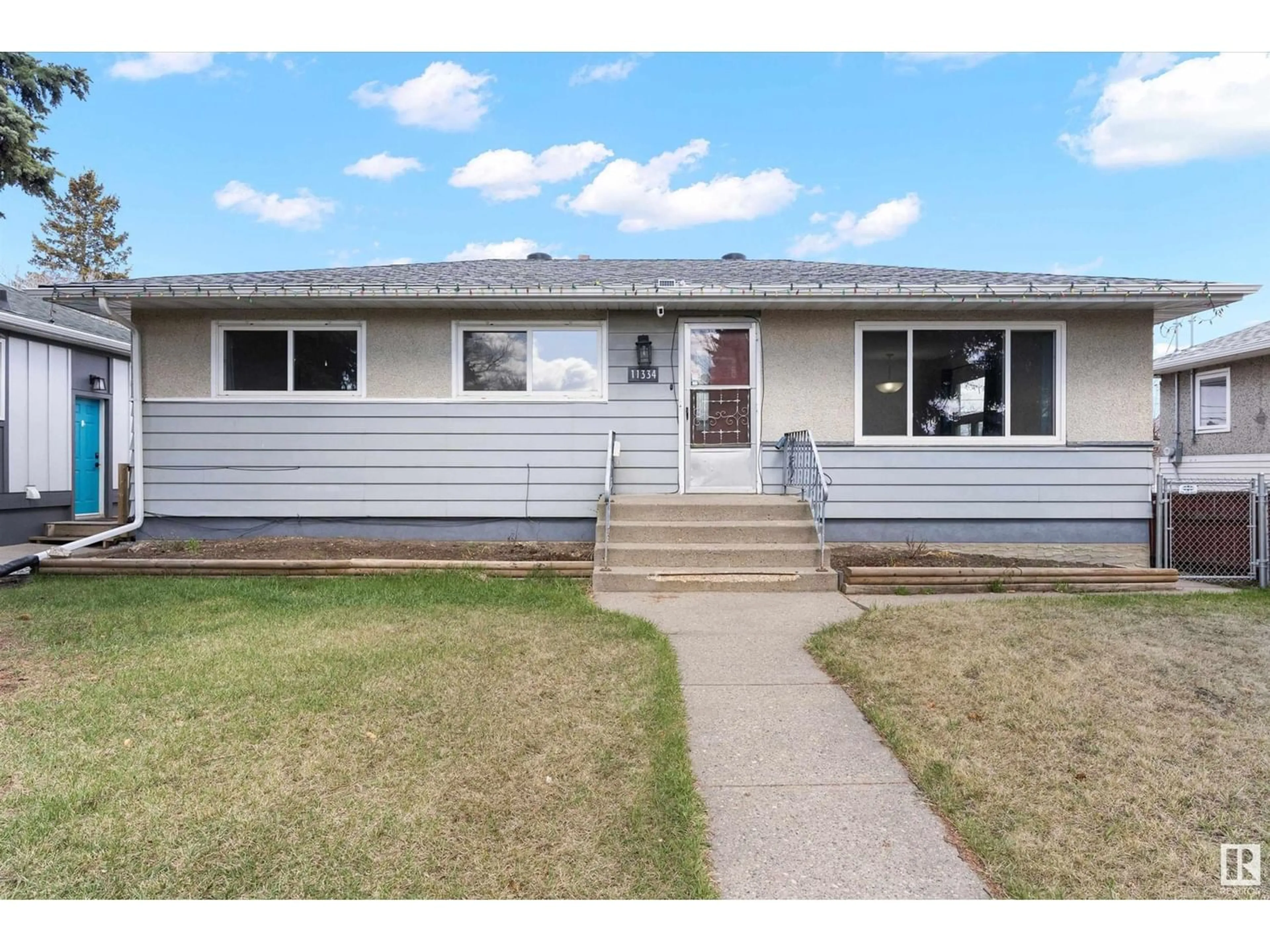 Frontside or backside of a home for 11334 111 AV NW, Edmonton Alberta T5G0C8