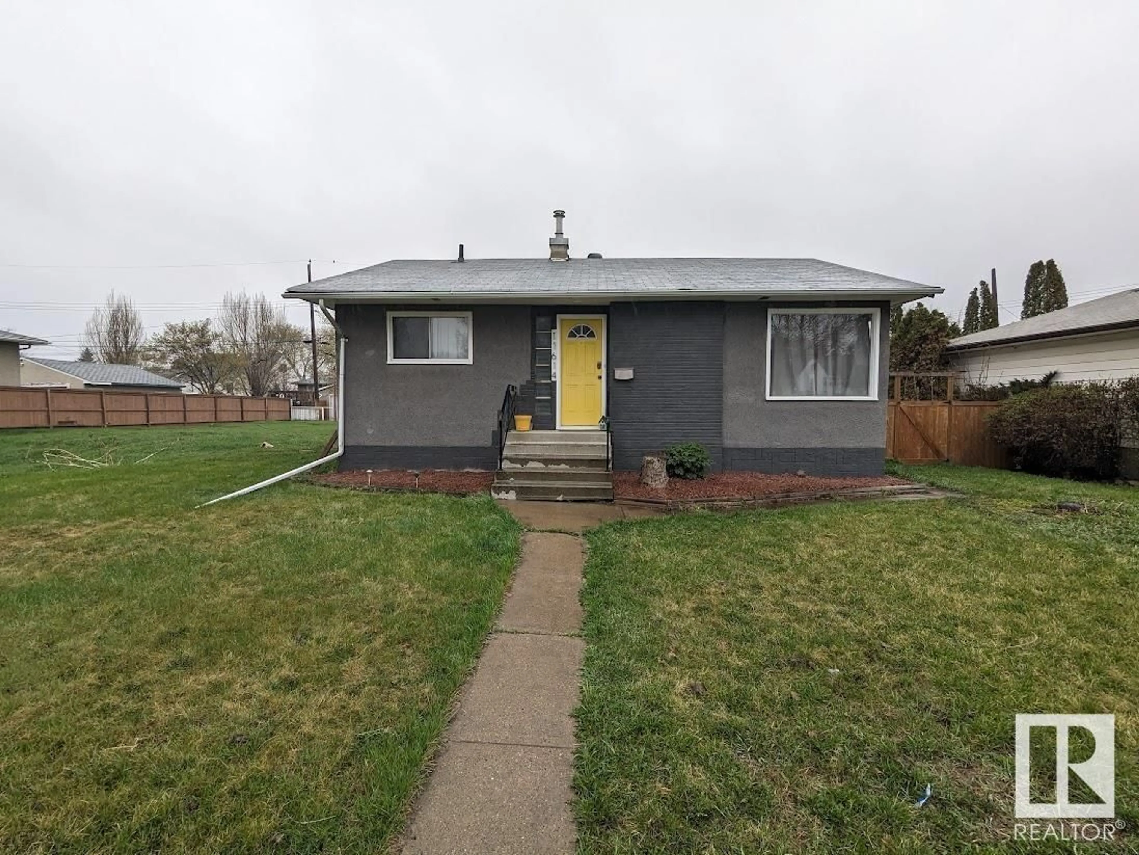 Frontside or backside of a home for 11614 111 AV NW, Edmonton Alberta T5G0E1