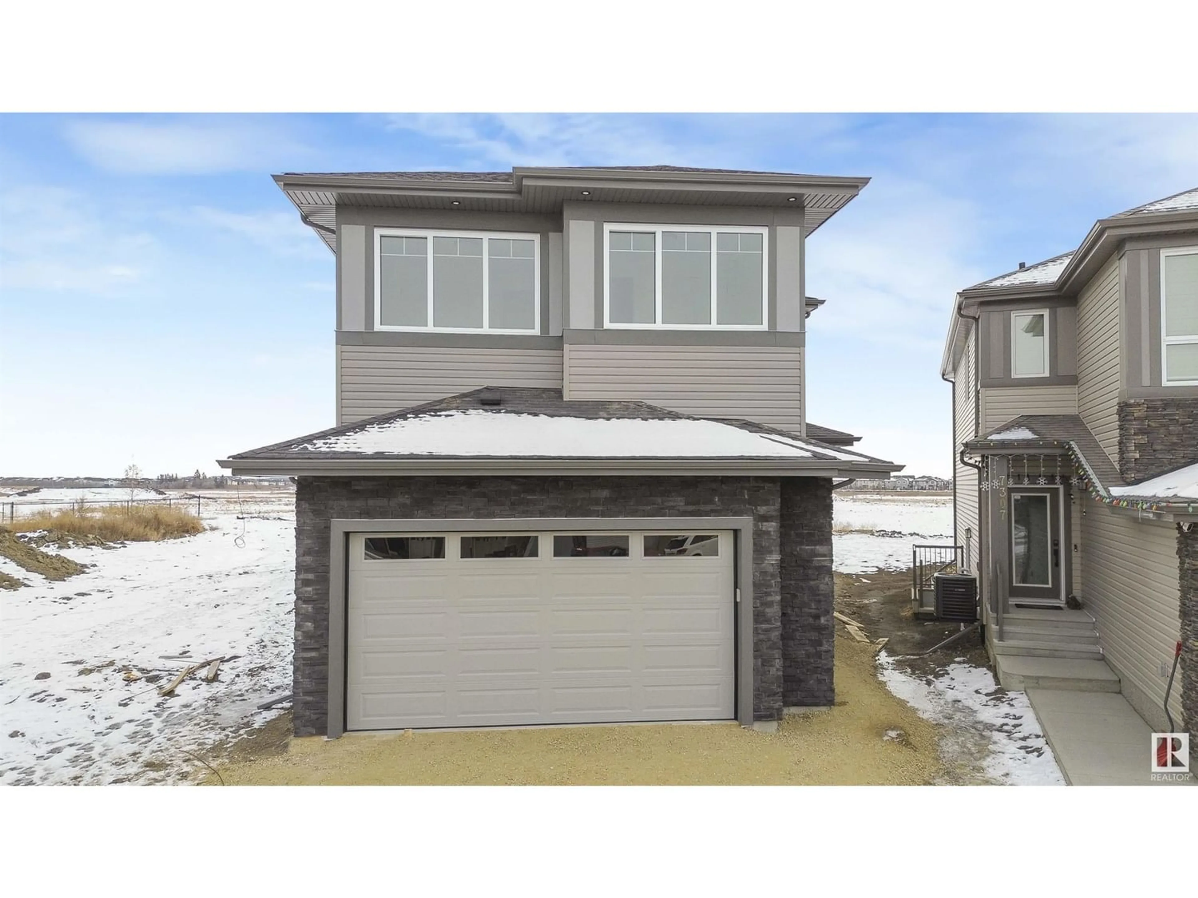 Frontside or backside of a home for 7303 177 AV NW, Edmonton Alberta T5Z0V9