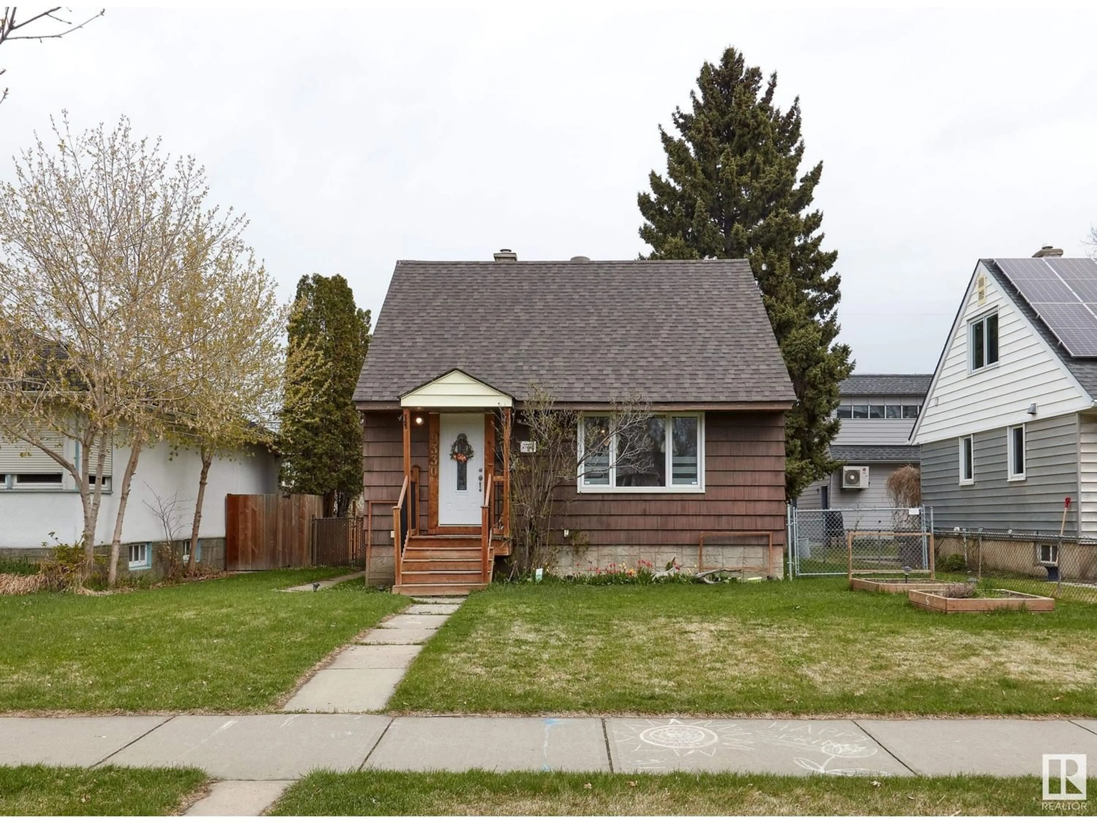 Frontside or backside of a home for 9330 73 AV NW, Edmonton Alberta T6E1A7
