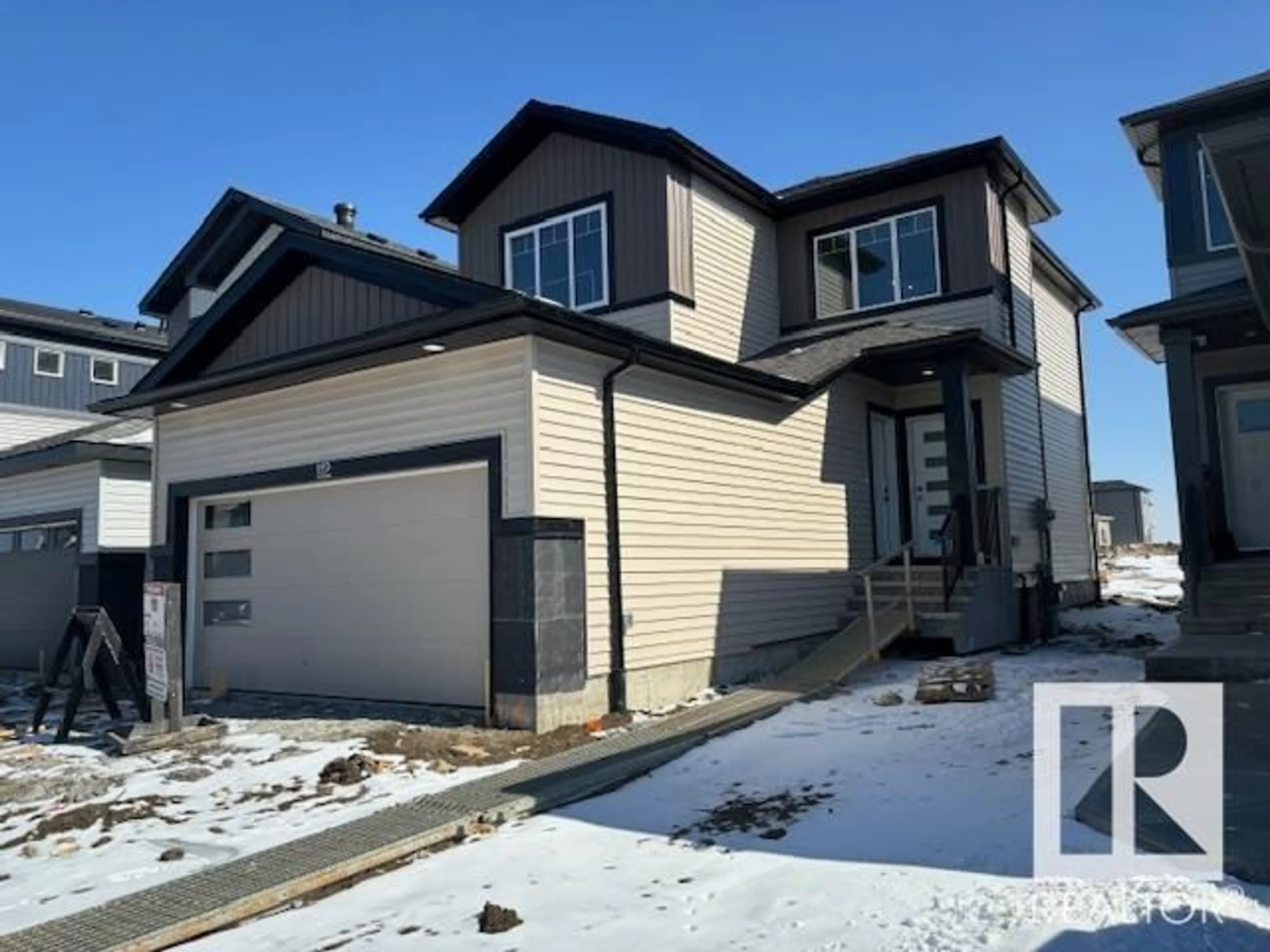 Frontside or backside of a home for 112 BLUFF CV, Leduc Alberta T9E1M8