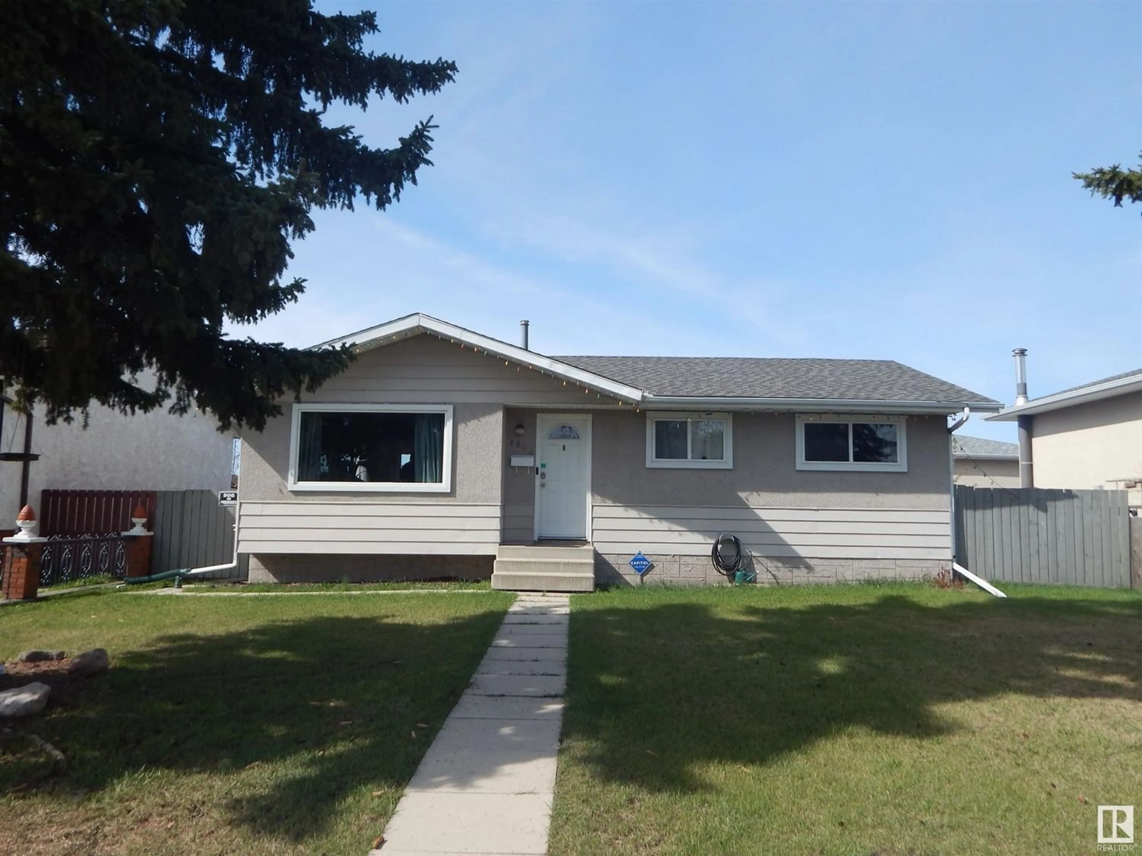 Frontside or backside of a home for 8904 150 AV NW, Edmonton Alberta T5E2N3