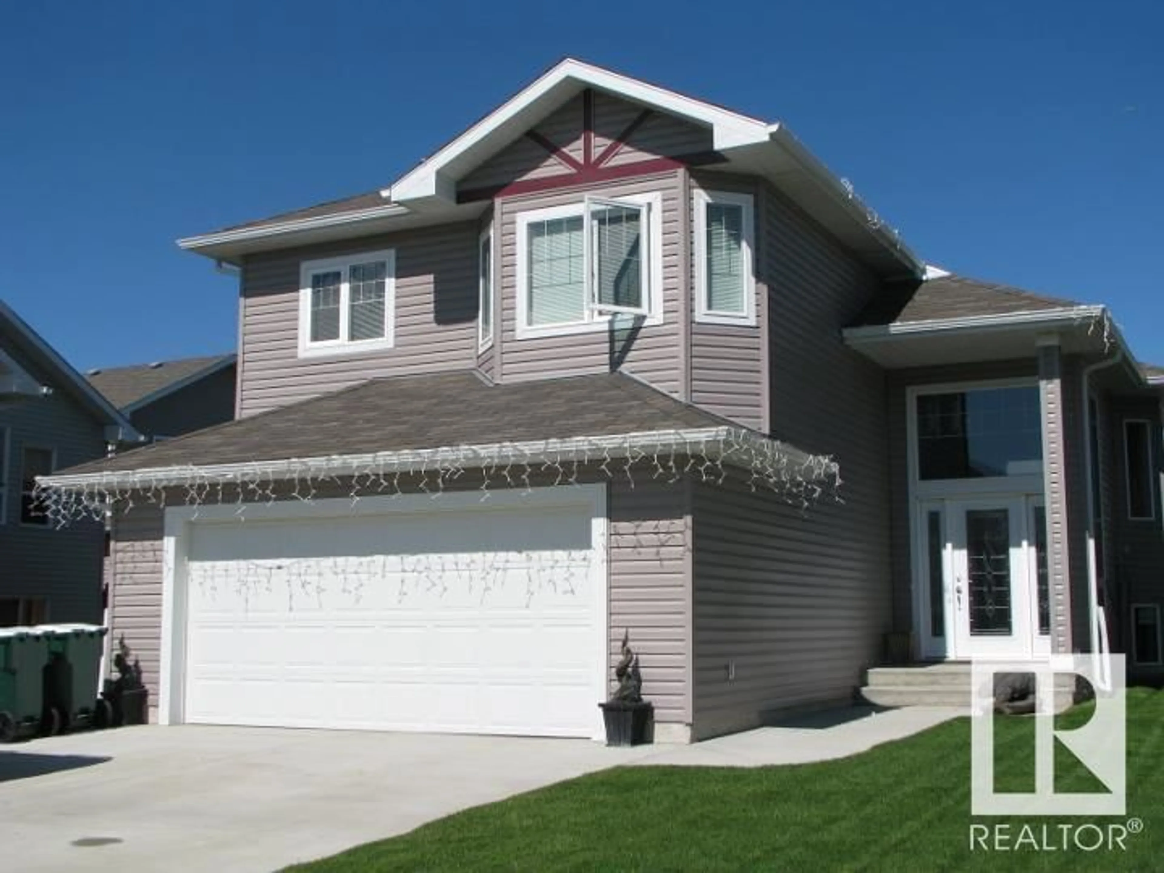 Frontside or backside of a home for 10406 94 ST, Morinville Alberta T8R0B2